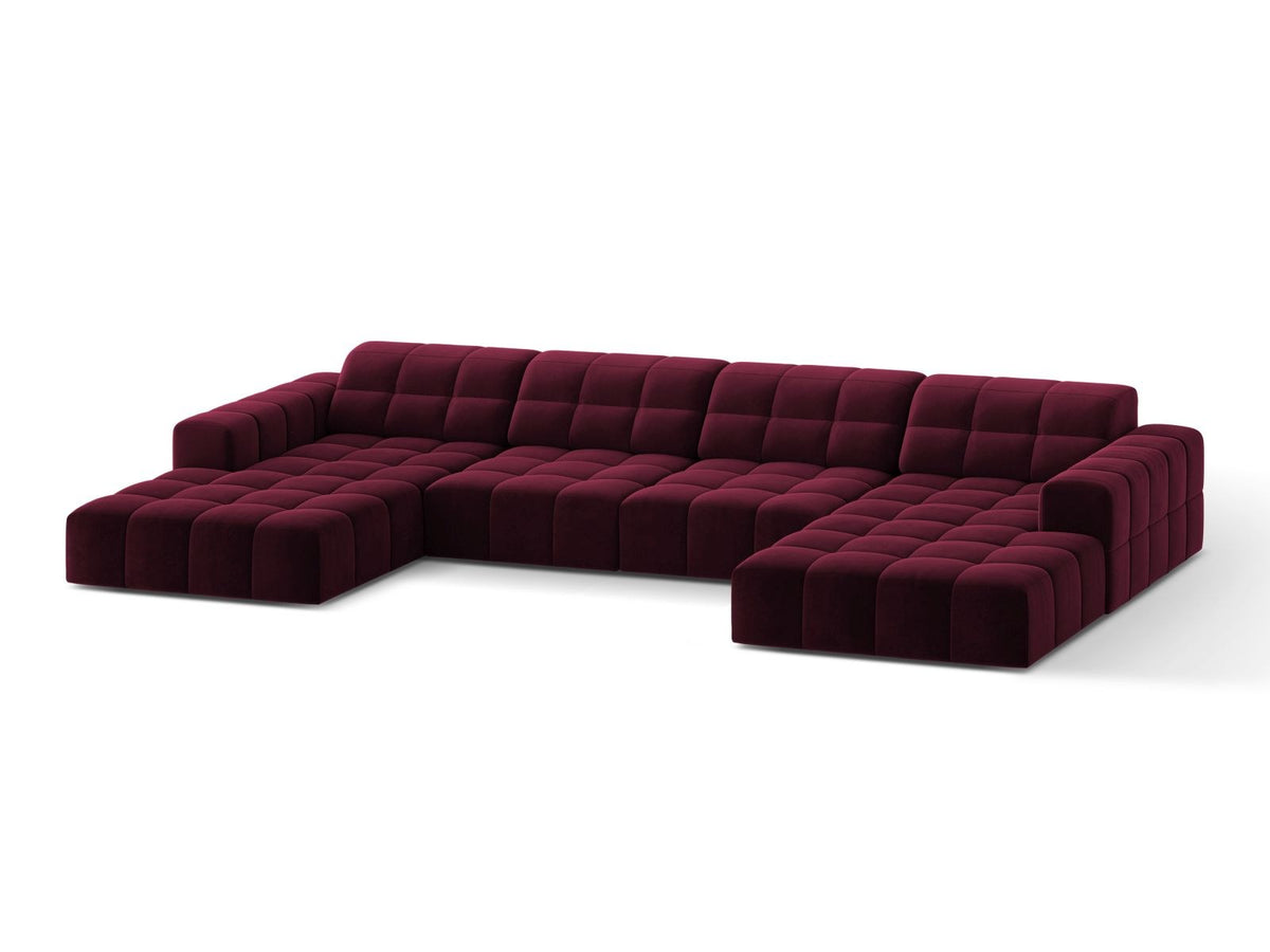 Beige-farbenes Panoramic-Sofa mit Samtbezug, sechs Sitzplätzen, abgewinkelter Rückenlehne und schwarzen Kunststoffbeinen.