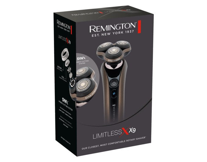 Bronzefarbener REMINGTON Rasierer XR1795 Limitless X9 mit rundem Scherkopf, Click-On Trimmer und Ladekabel auf hellem Hintergrund.
