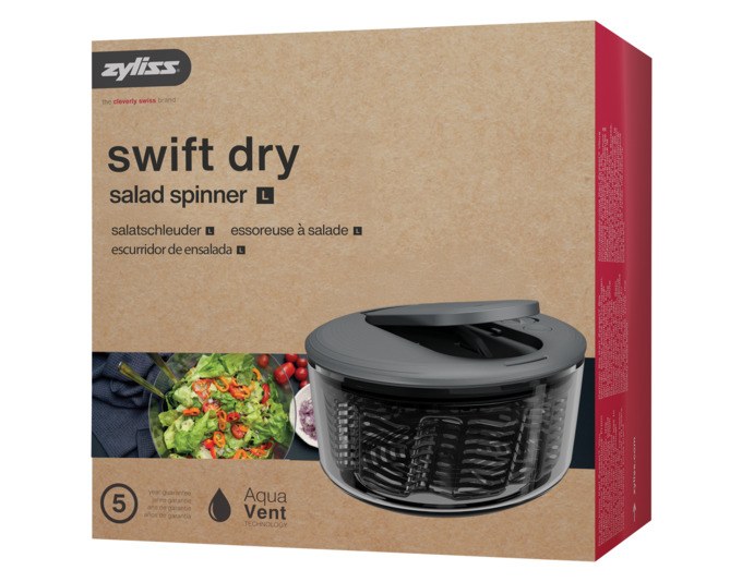 Salatschleuder ZYLISS Swift Dry L aus Kunststoff in Grau und Schwarz, runde Form mit Ausgiesser, Deckel und Stopp-Taste auf der Oberseite.