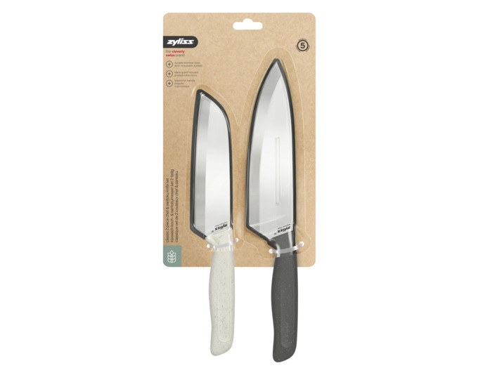 Zwei Messer des ZYLISS Messerset Classic mit anthrazit-violetten Weizenstroh-Griffen und Edelstahlklingen, teils mit durchsichtiger Schutzhülle.