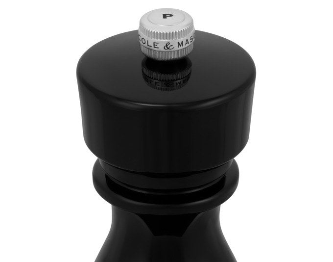 Schwarze Pfeffermühle London von COLE & MASON aus Acryl, 15 cm hoch, mit zylindrischer Form und einstellbarem Mahlwerk am oberen Ende.
