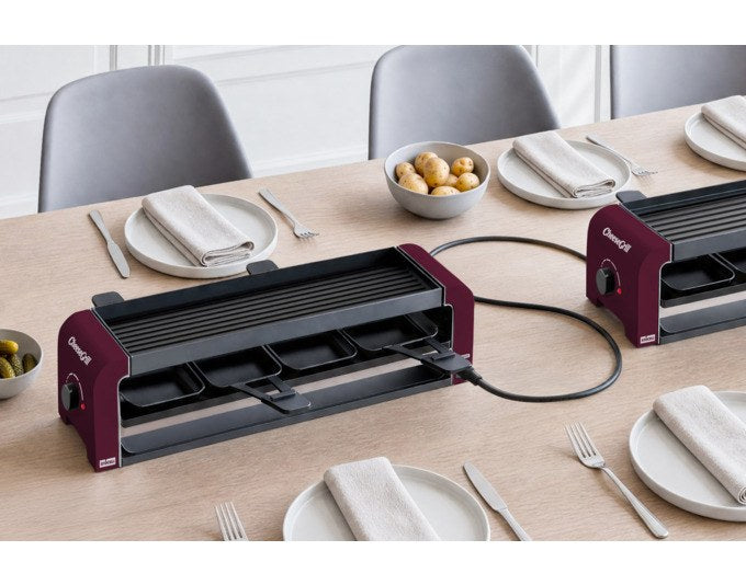 Roter STÖCKLI Tischgrill CheeseGrill 4 Connect mit vier antihaftbeschichteten Pfännchen und wendbarer Aluguss-Grillplatte für Raclette und Grillgerichte.