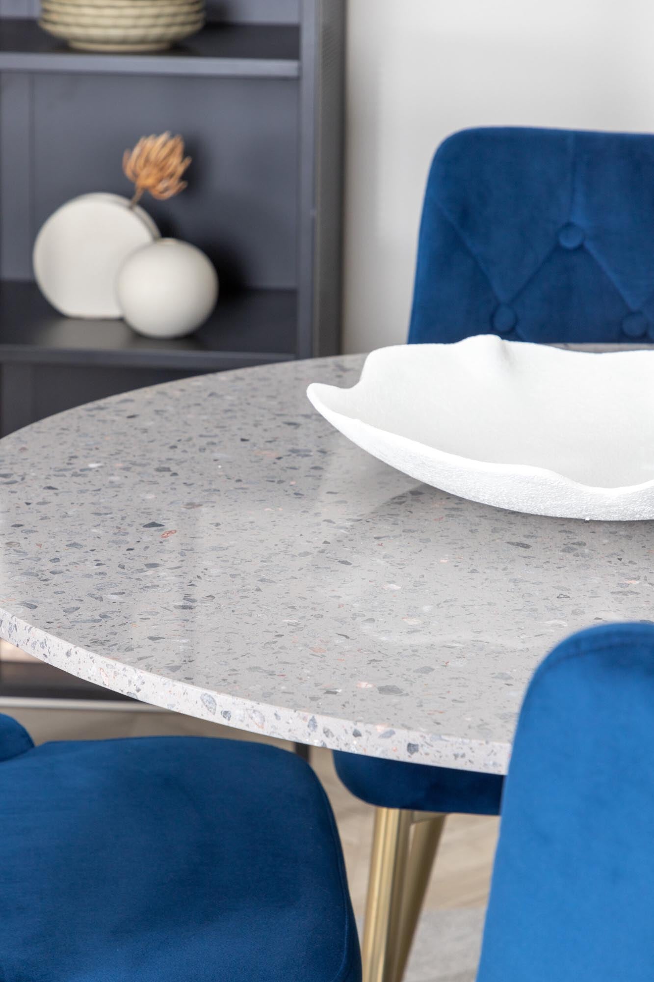 Elegantes Esszimmerset mit Samtstühlen und rundem Tisch für stilvolle und komfortable Essbereiche.