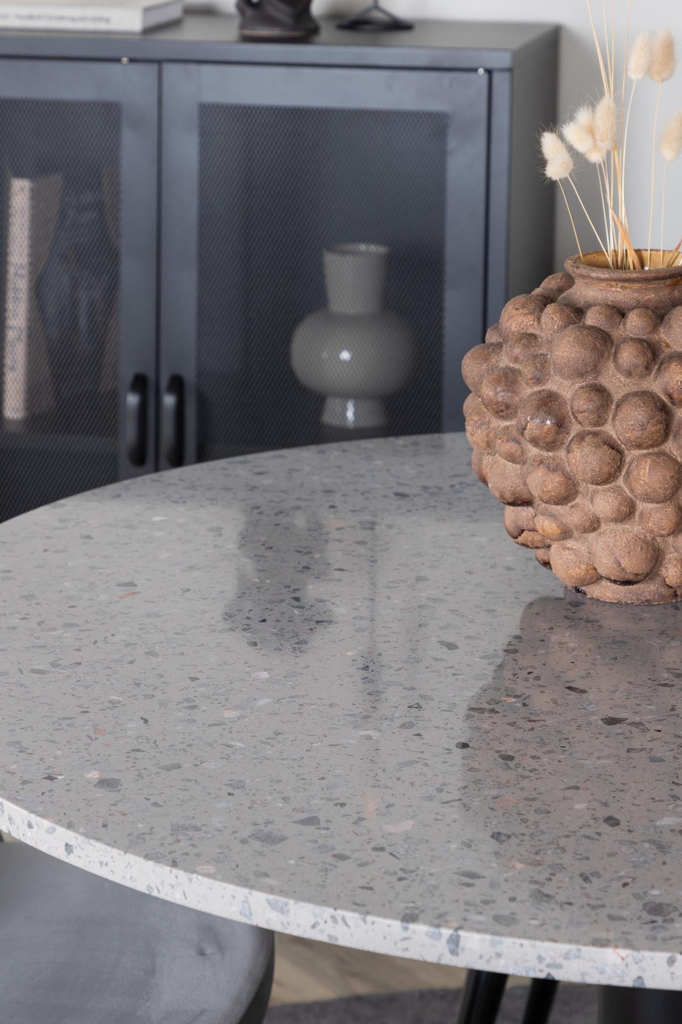 Entdecken Sie das Razzia Esszimmerset von Venture Home: Moderner Tisch (106 cm) und 4 stilvolle Velvet-Stühle für höchsten Komfort und Eleganz.