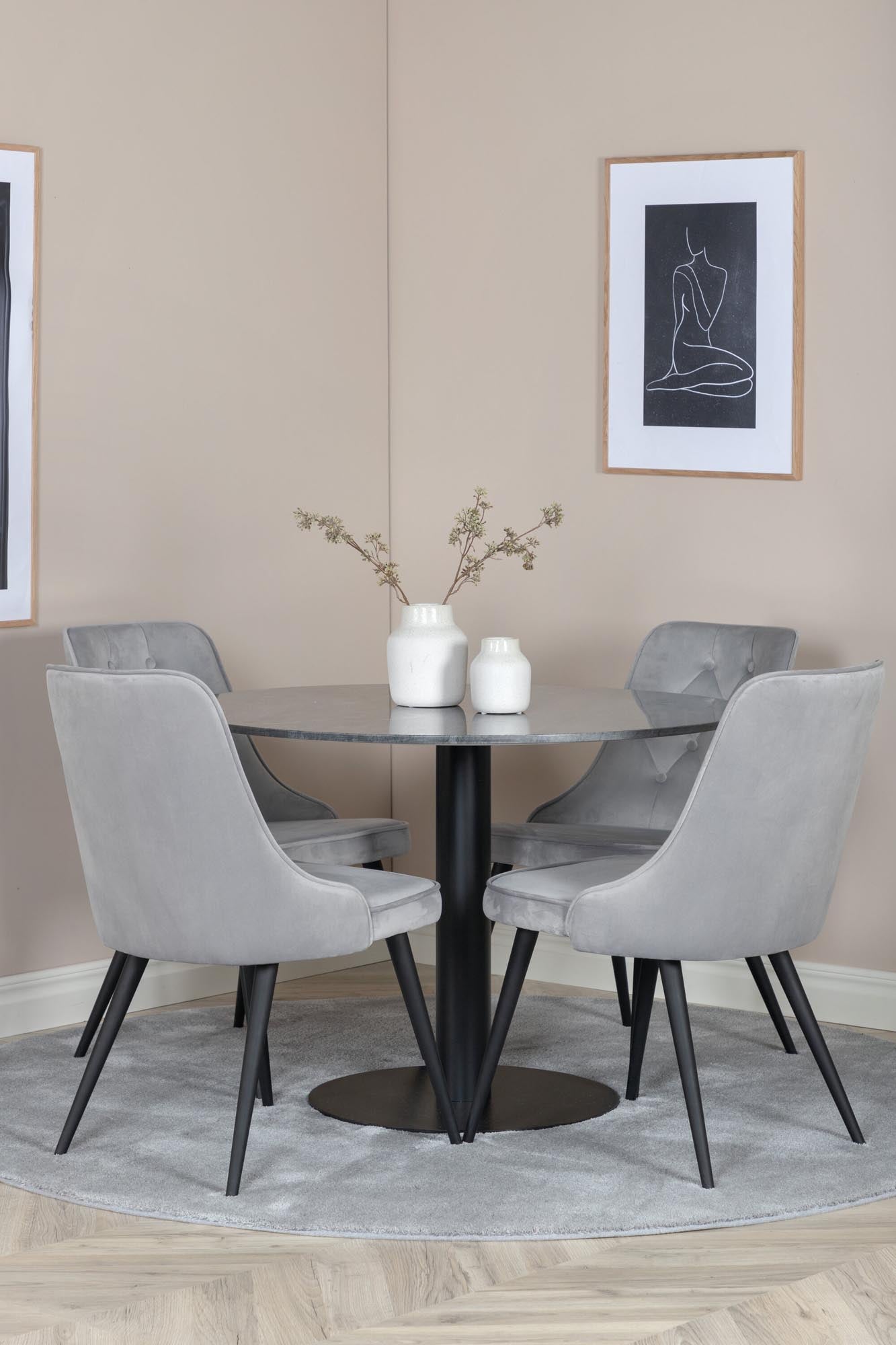 Stilvolles Esszimmerset mit luxuriösem Marmor-Tisch und bequemen Samtstühlen. Perfekt für gesellige Abende und zeitlose Eleganz.