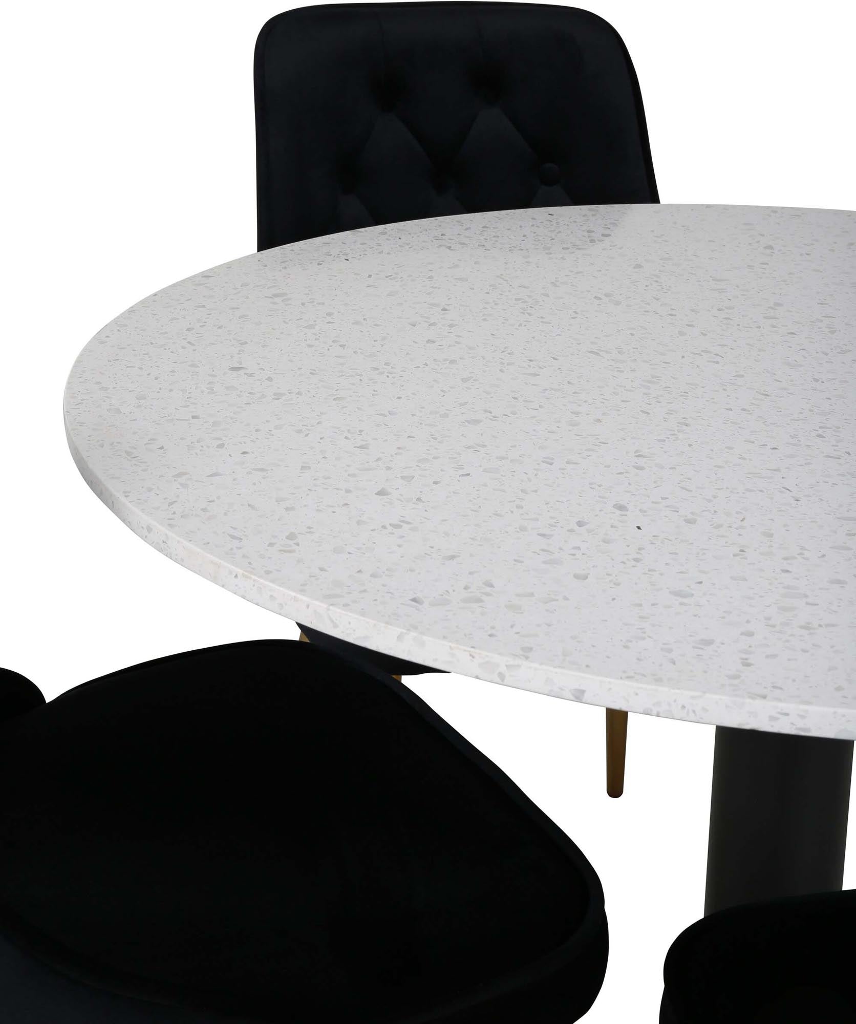 Elegantes Esszimmerset mit Samtstühlen und rundem Tisch für stilvolle und komfortable Essbereiche.