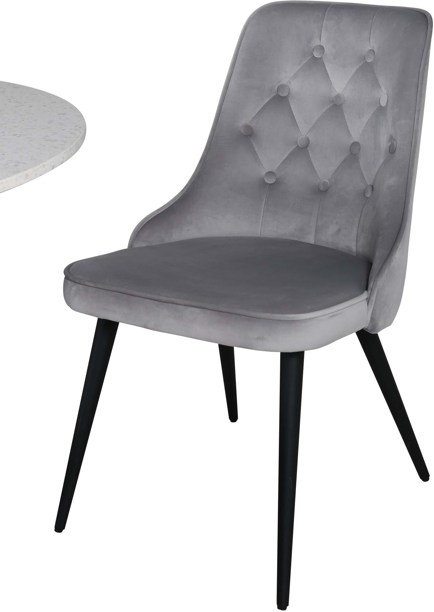 Elegantes Esszimmerset mit luxuriösen Samtstühlen und einem großzügigen Tisch, ideal für gesellige Anlässe und stilvolle Einrichtung.