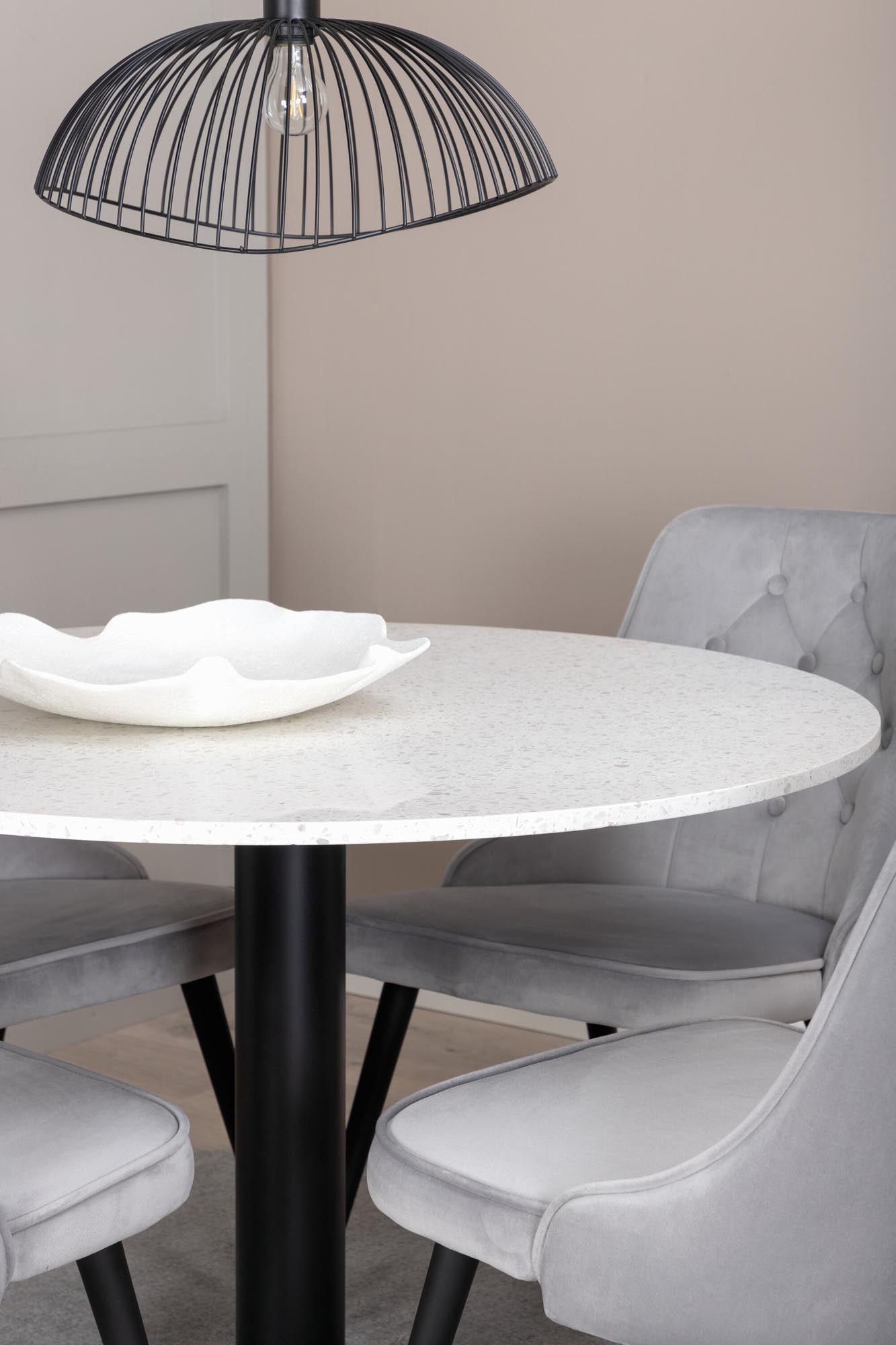 Luxuriöses Esszimmerset mit Samt für exklusives Wohngefühl.