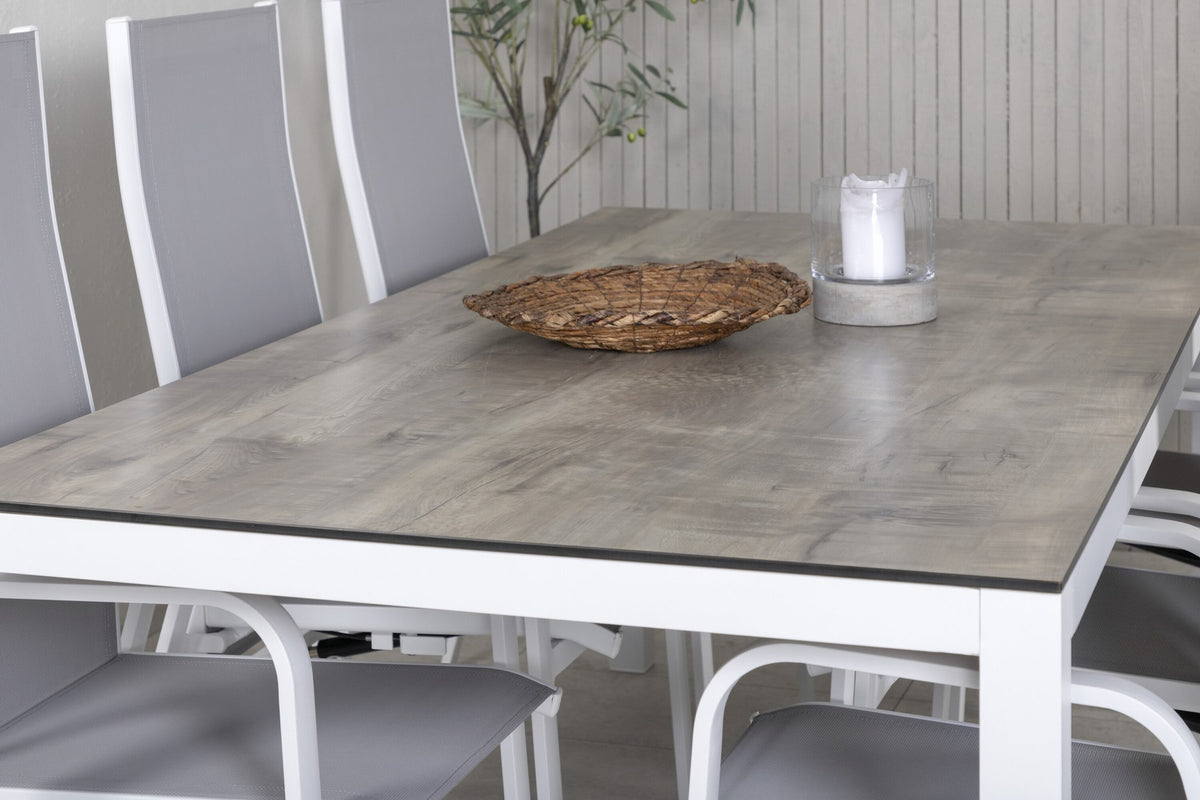 Graues Gartentischset aus Aluminium und HPL: rechteckiger Esstisch 205x100 cm mit zwei Relaxsesseln, pulverbeschichtete Oberfläche.
