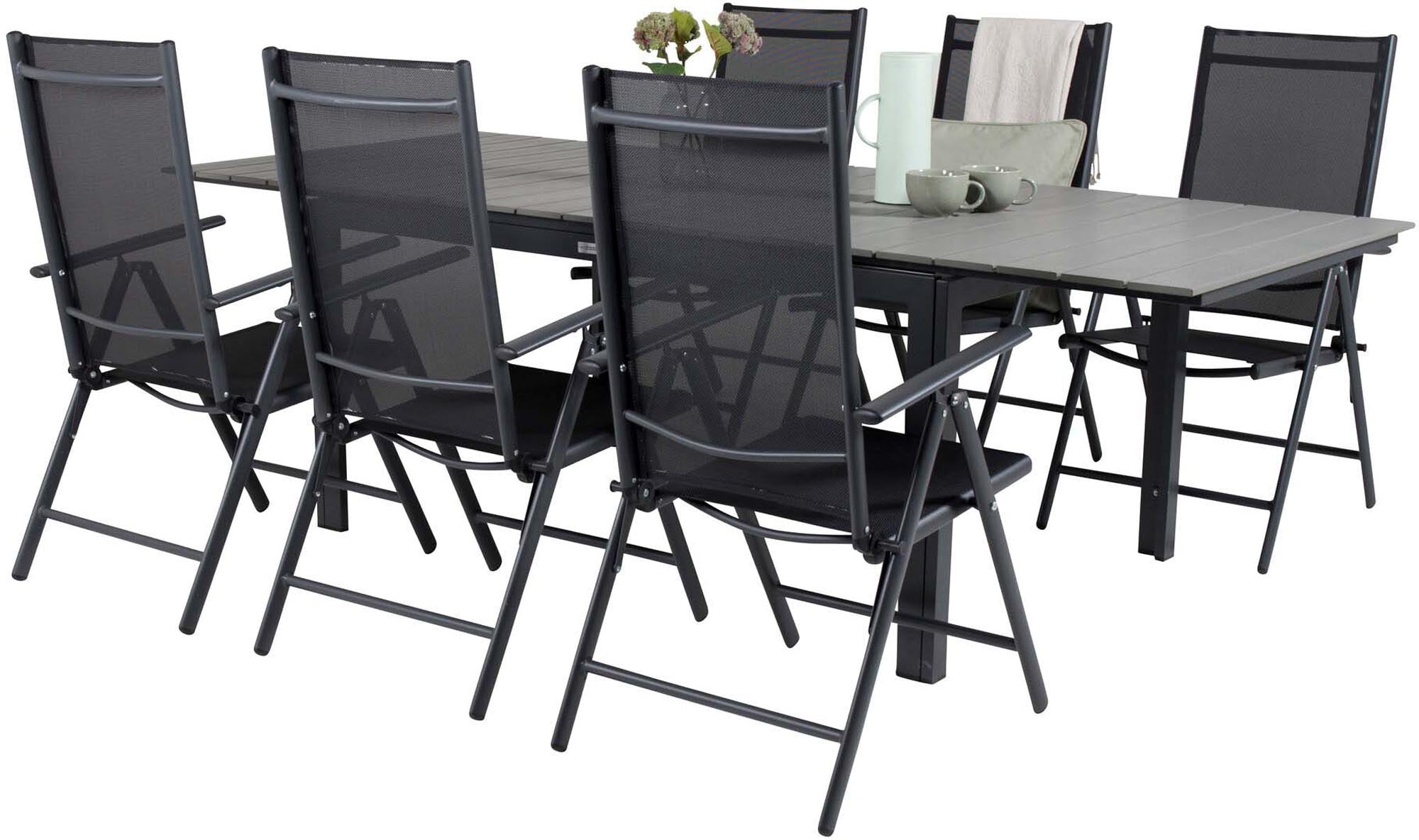 Elegantes und funktionales Outdoor-Tischset mit ausziehbarem Tisch und robusten Stühlen für stilvolle Essensmomente im Freien.