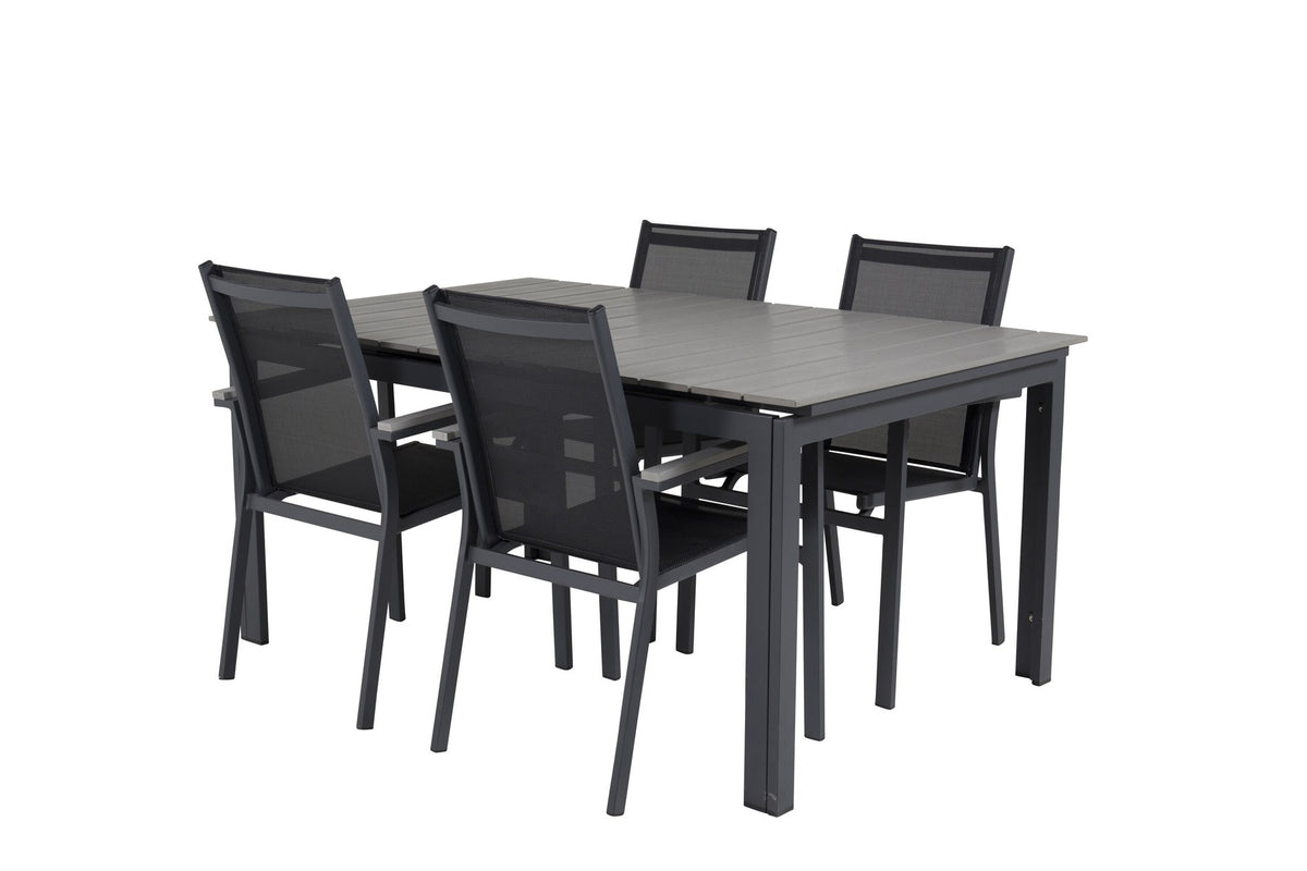 Rechteckiger Esstisch aus Aintwood mit Aluminiumgestell in Anthrazit, dazu zwei stapelbare Stühle mit pulverbeschichteter Oberfläche.
