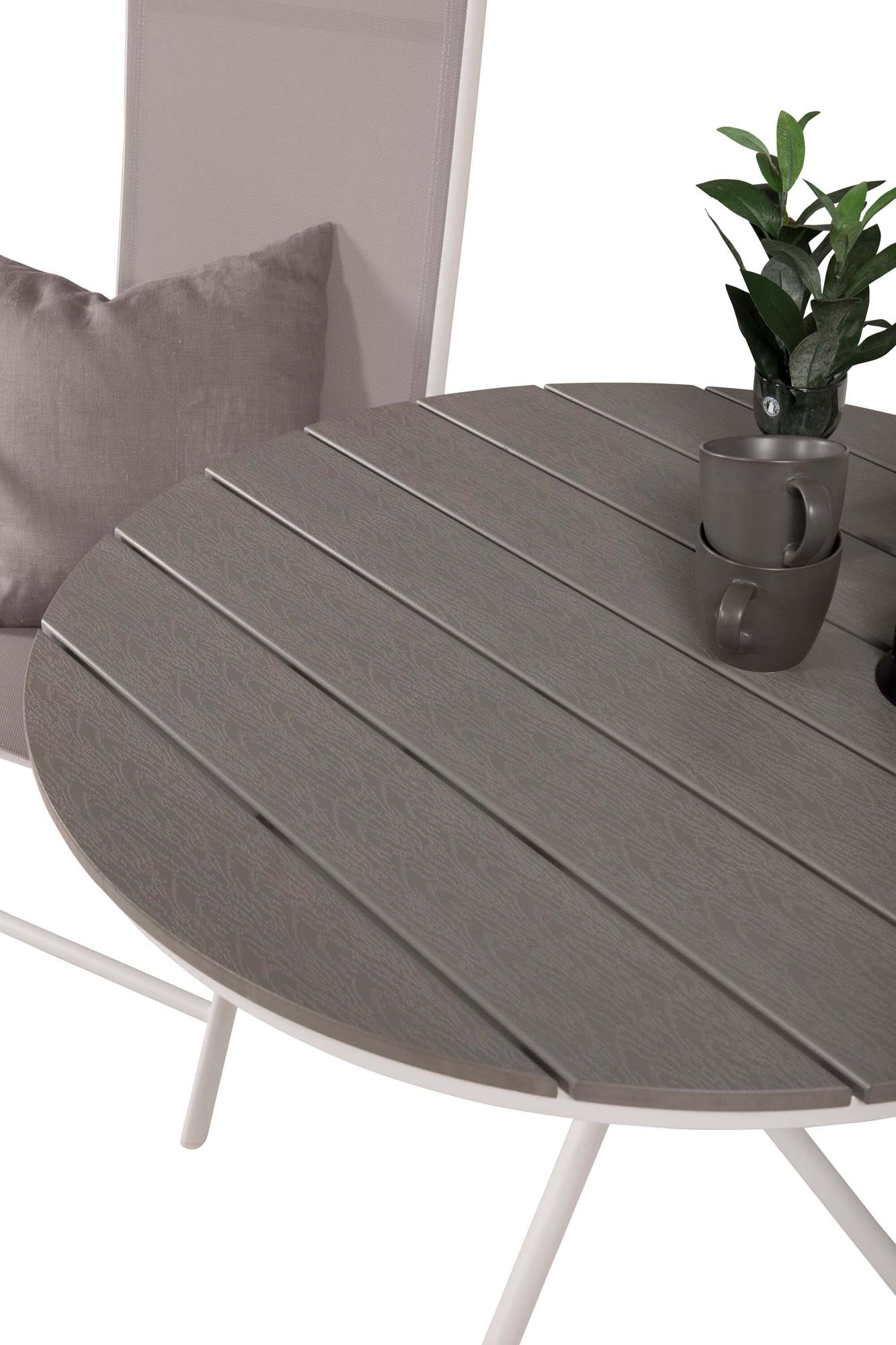 Erleben Sie mit dem Parma Outdoor-Tischset von Venture Home gesellige Stunden im Freien. Der elegante runde Tisch und die flexiblen Stühle bieten Komfort und Stil für jeden Anlass.