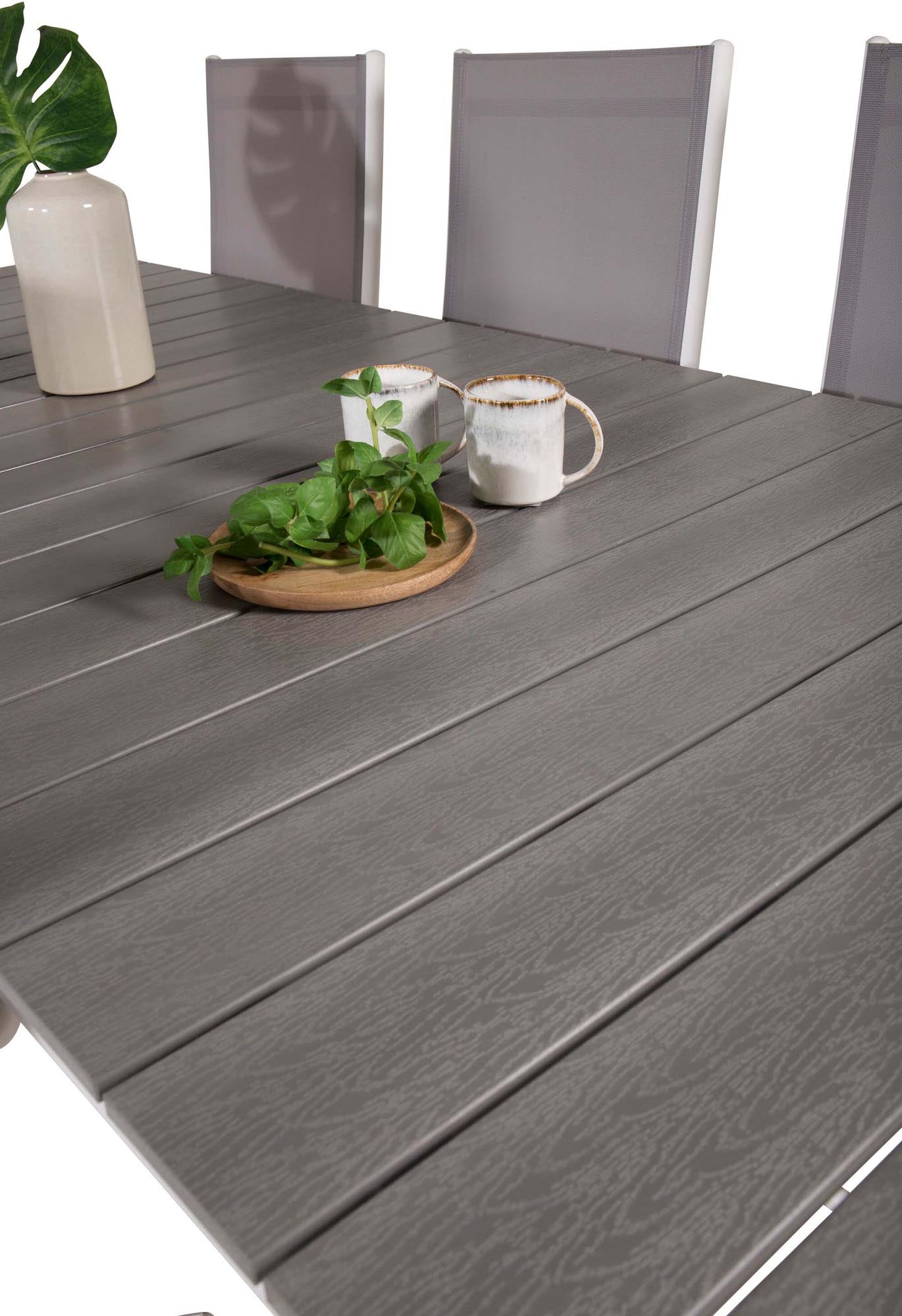 Stilvolles Outdoor-Tischset von Venture Home: Robuster 229cm Tisch & 6 bequeme, wetterfeste Stühle für gesellige Abende.