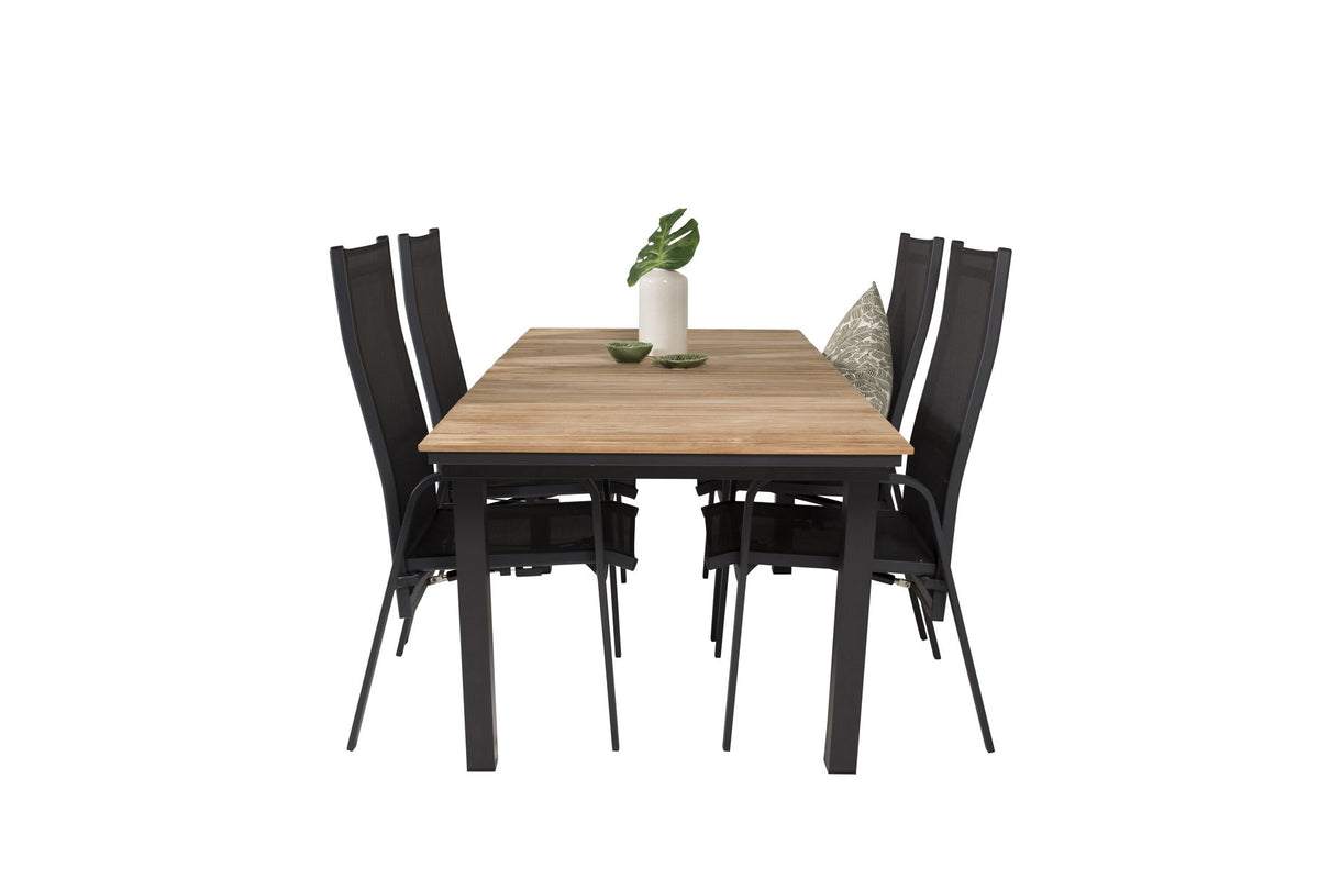 Zwei schwarze Relaxsessel Copacabana aus Aluminium mit Pulverbeschichtung neben rechteckigem Teak-Esstisch Mexico in Natur, Gartenmöbel-Set.