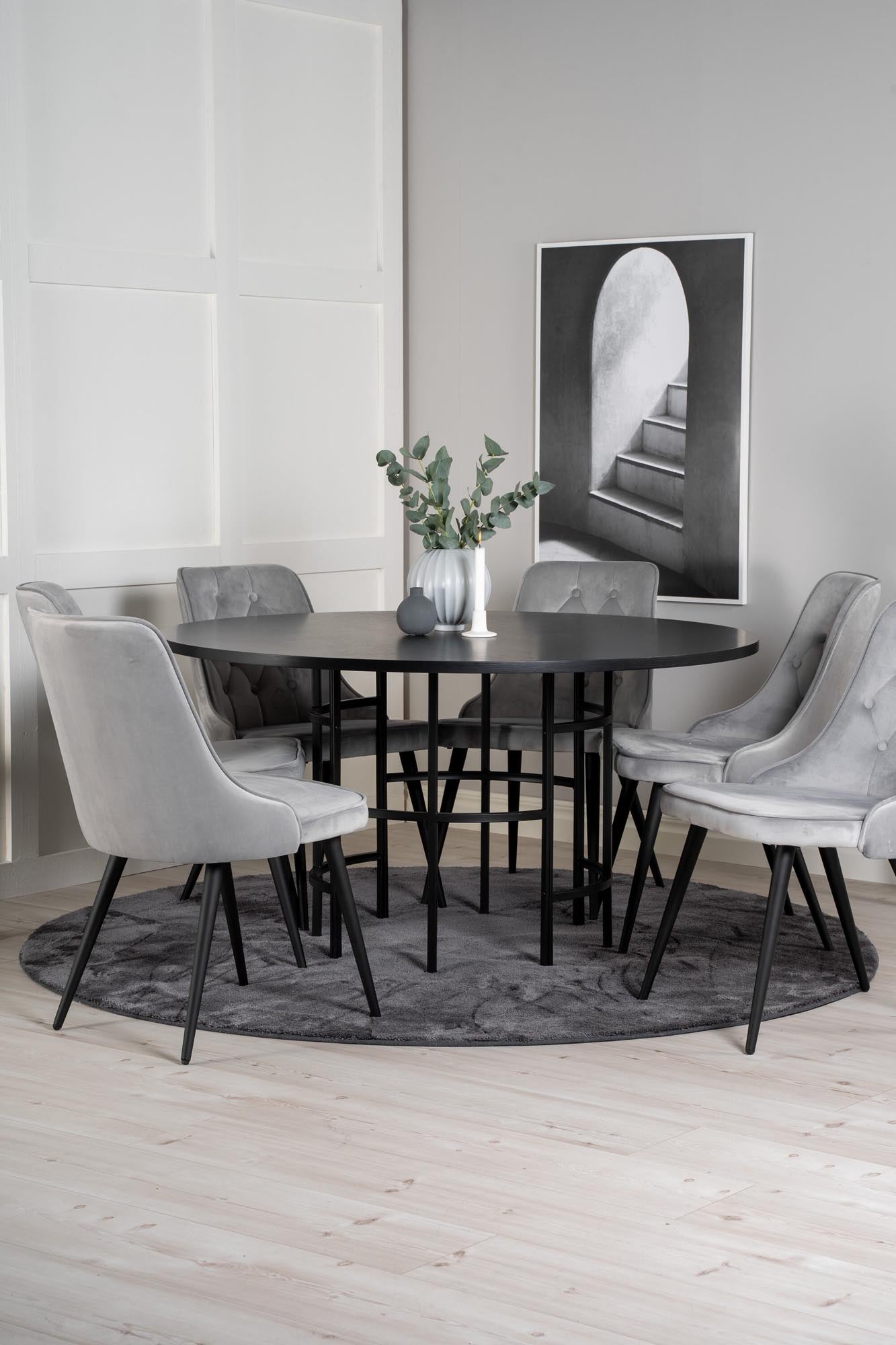 Elegantes Esszimmerset mit rundem Tisch (⌀140cm) und 6 bequemen Velvet Deluxe Stühlen für stilvolle Dinner und gesellige Abende.