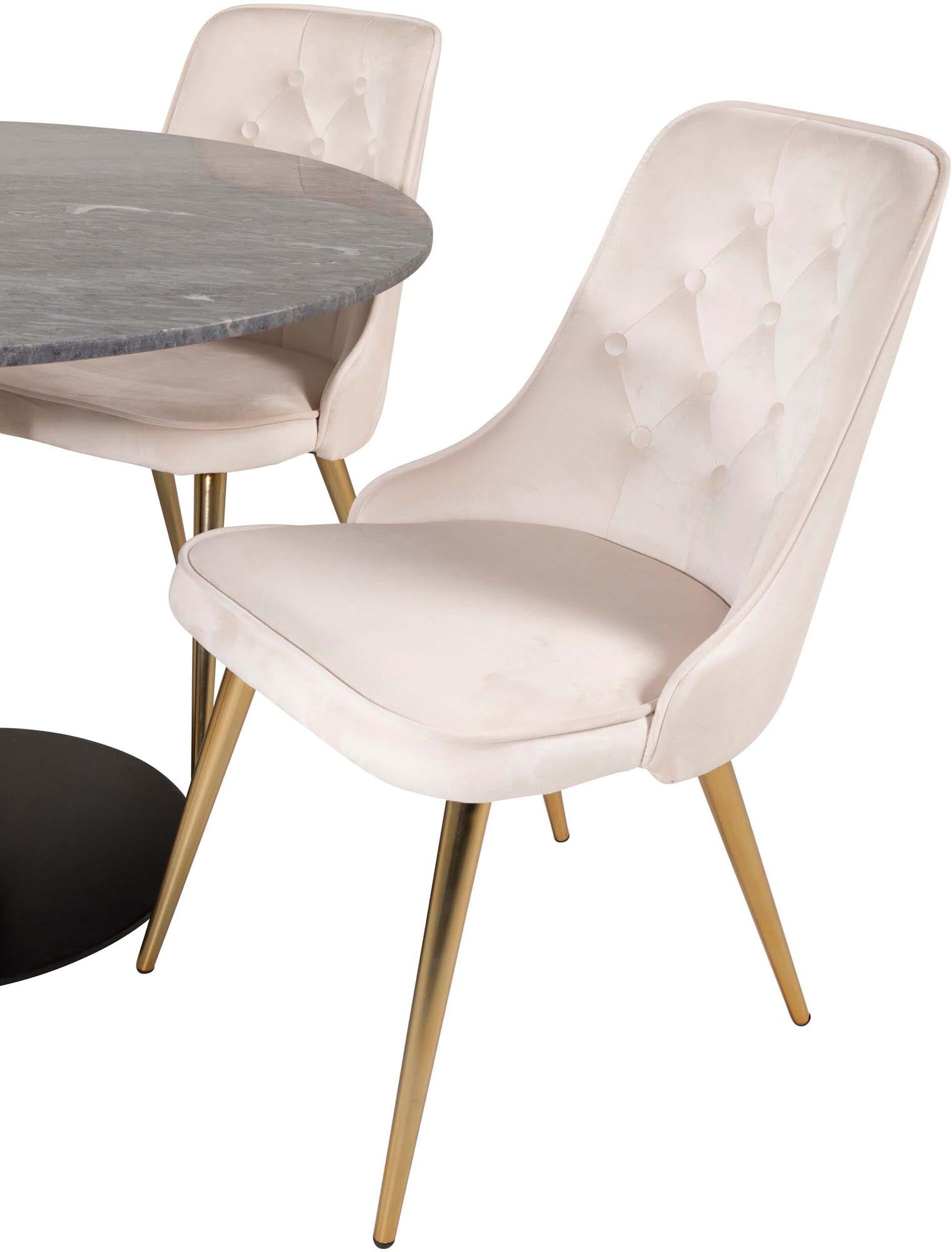 Luxuriöses Esszimmerset mit rundem Tisch und vier Samtstühlen.