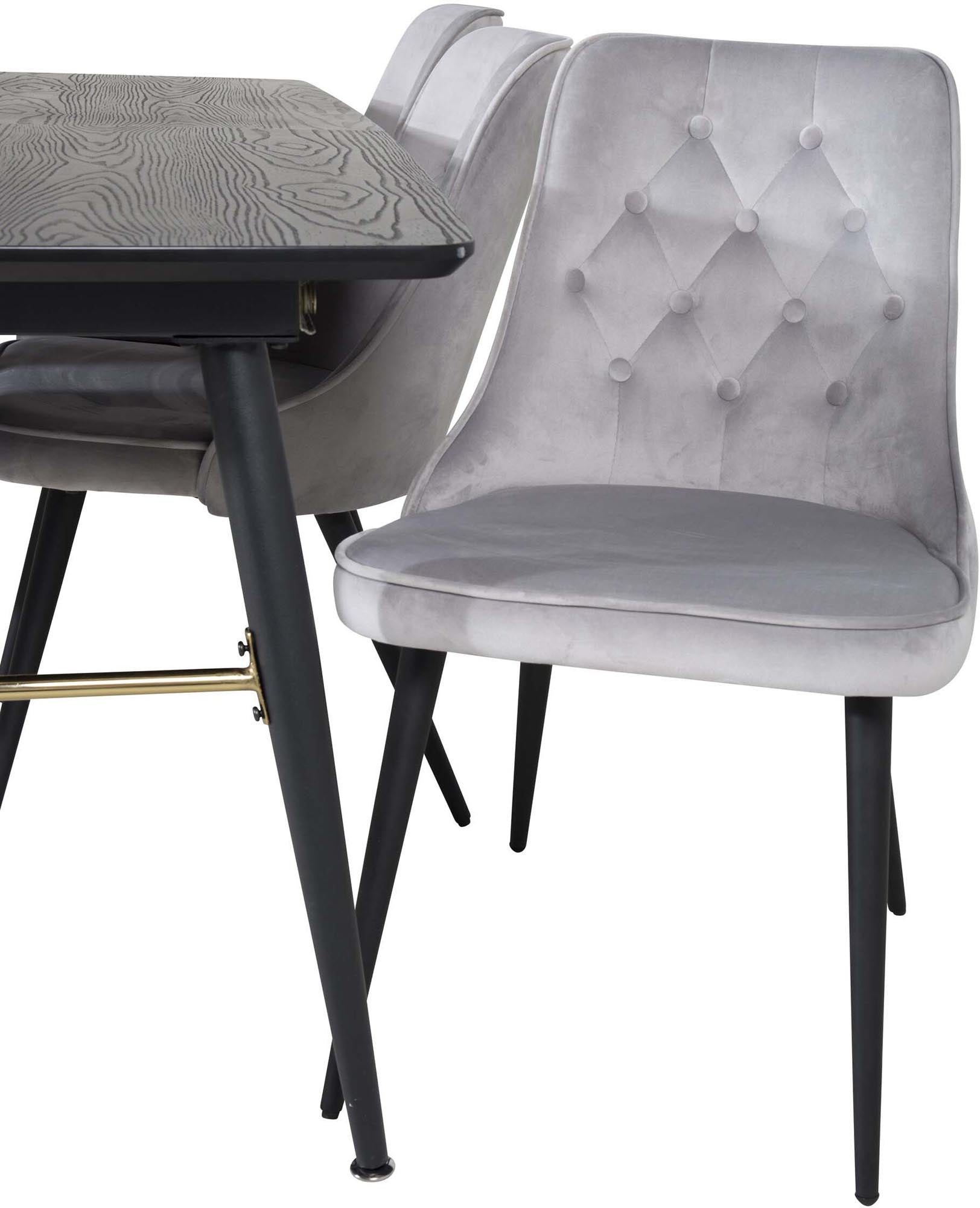 Stilvolles Esszimmerset mit ausziehbarem Tisch und Samtstühlen.