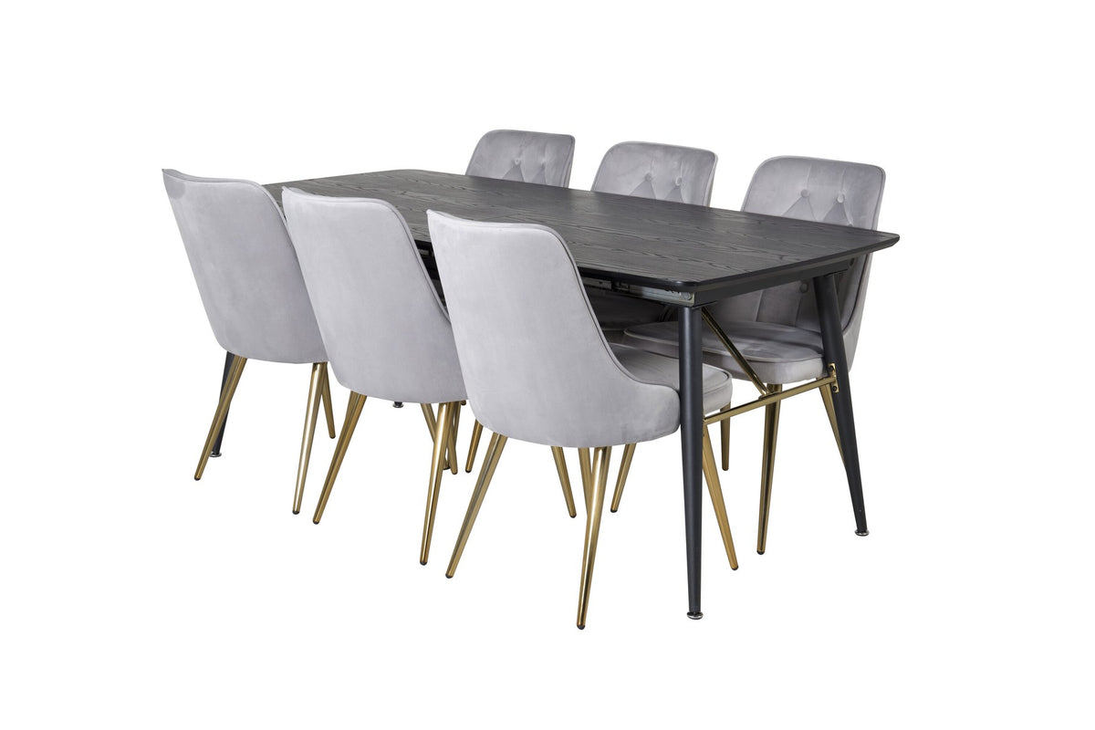 Ausziehbarer Esstisch mit schwarzer MDF-Platte und goldenen Stahlbeinen, umgeben von sechs schwarzen Samtstühlen mit Stahlgestell.