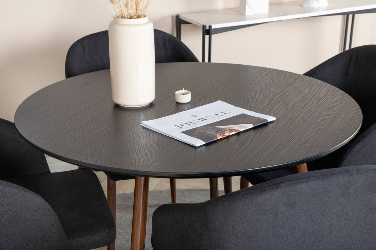 Schwarzes Esszimmerset mit rundem Tisch Ø100 cm, MDF-Tischplatte, Stahlgestell und zwei Stühlen mit gepolsterter Sitzfläche.