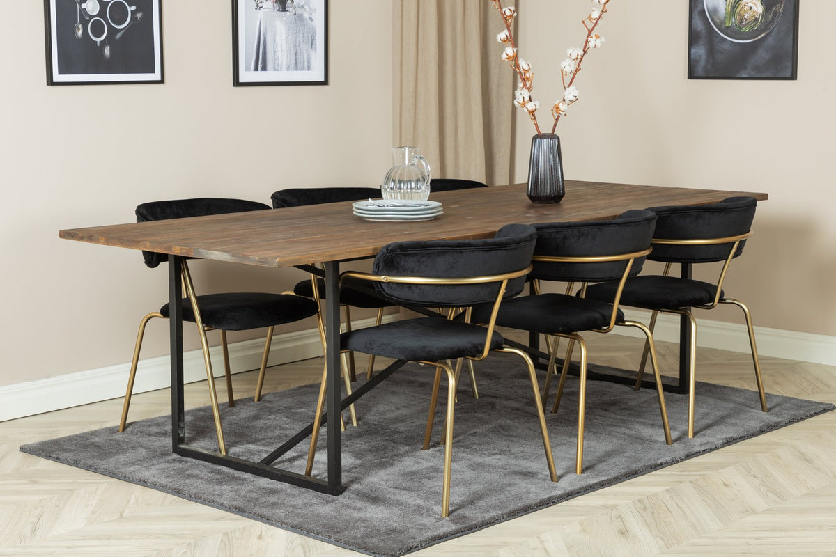 Esszimmerset Padang mit Arrow Stühlen: schwarzer Stahltisch mit Teak-Tischplatte, Stühle mit Messing-Pulverbeschichtung und Polyester-Samt-Bezug.