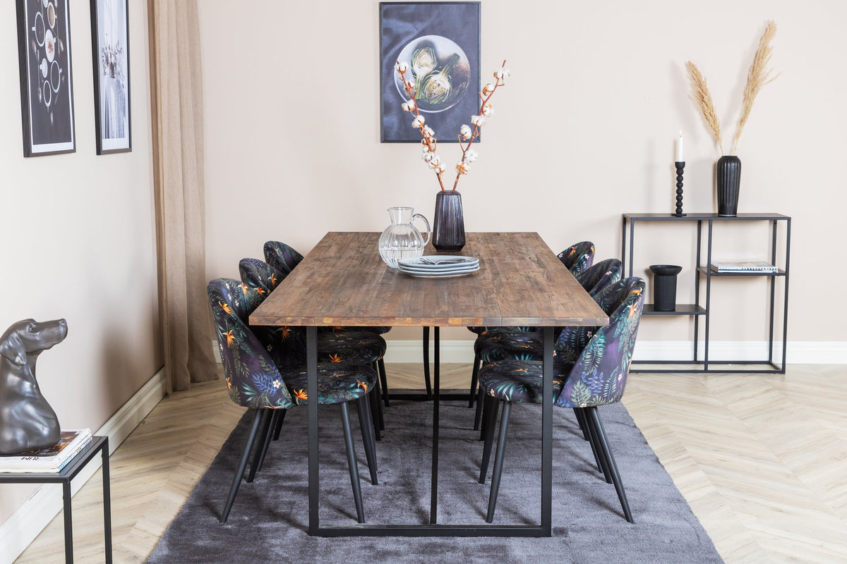 Schwarzes Esszimmerset Padang mit Teak-Tischplatte, Stahlgestell und gepolsterten Velvet-Stühlen mit schwarzem Samtbezug.