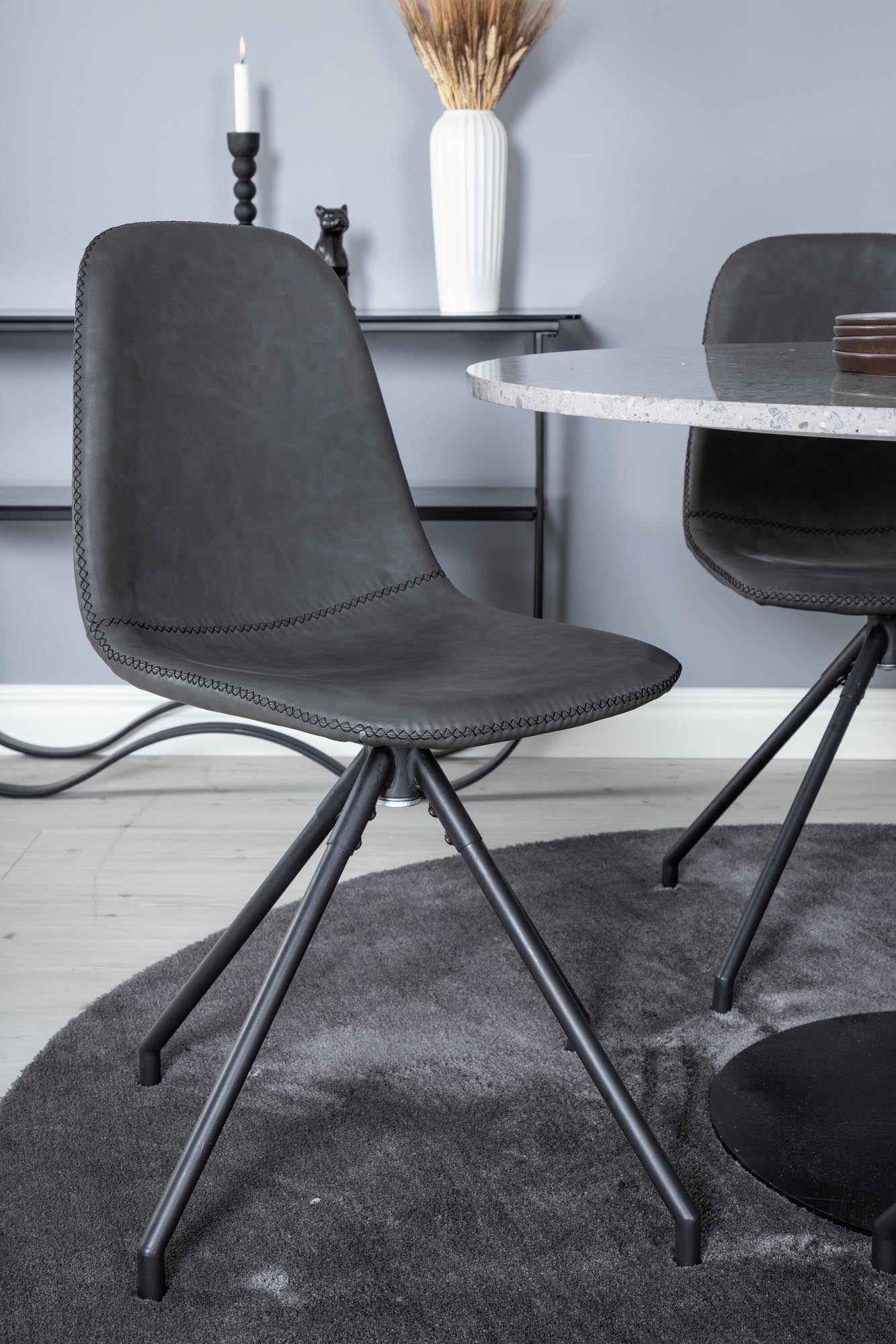 Stilvolles Razzia Esszimmerset von Venture Home: runder Tisch mit marmorierter Oberfläche und luxuriösen Samtstühlen für Ihr modernes Zuhause.