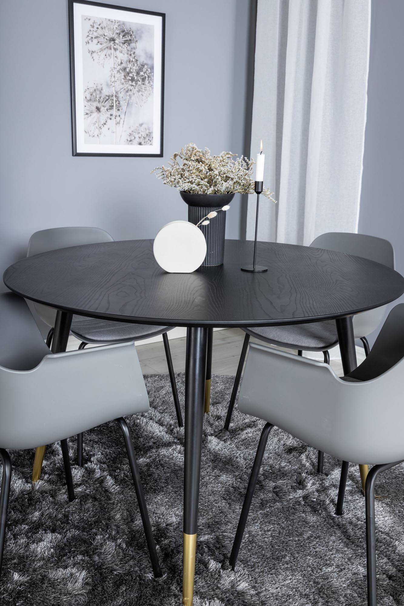 Entdecken Sie das Dipp Esszimmerset von Venture Home: stilvoller runder Tisch für 4, robuste Tischplatte und bequeme Stühle für gesellige Abende.