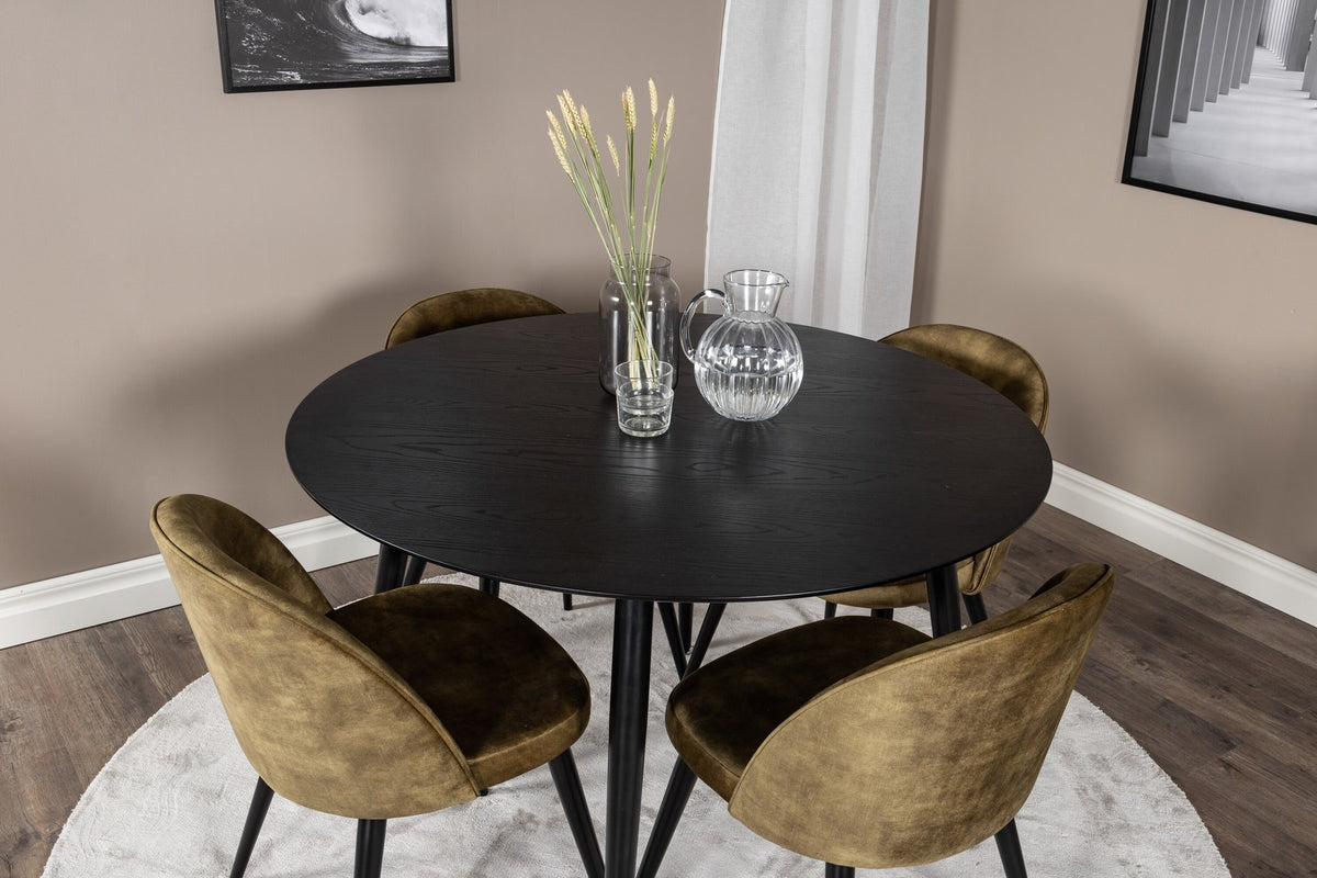Rundes Dipp Esszimmerset: Esstisch ⌀115 cm mit schwarzem Furnier und schwarzen Beinen, dazu vier Velvet-Stühle mit schwarz-grauem Mikrofaserbezug.