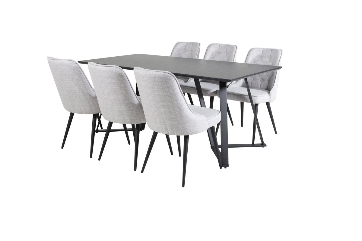 Esszimmerset von Venture Home: rechteckiger Esstisch mit schwarzer MDF-Platte und Stahlgestell, zwei graue Samt-Stühle mit gepolstertem Sitz.