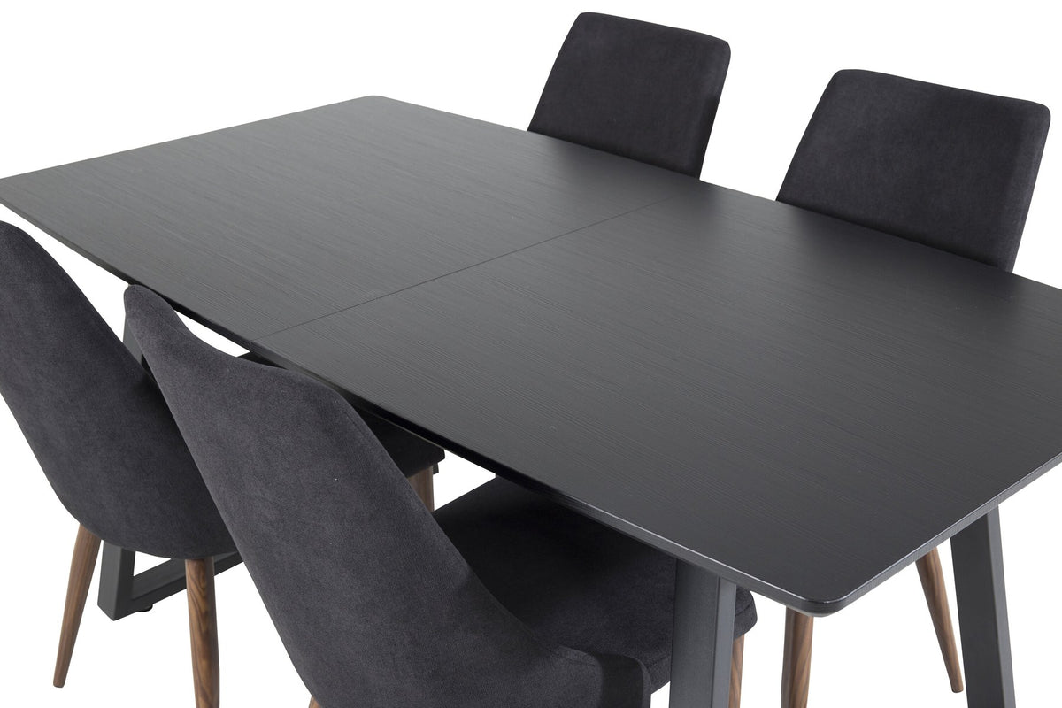 Zwei schwarze Esszimmerstühle mit Stahlbeinen und ausziehbarer schwarzer Esstisch mit MDF-Platte, Serie Leone & Inca von Venture Home.