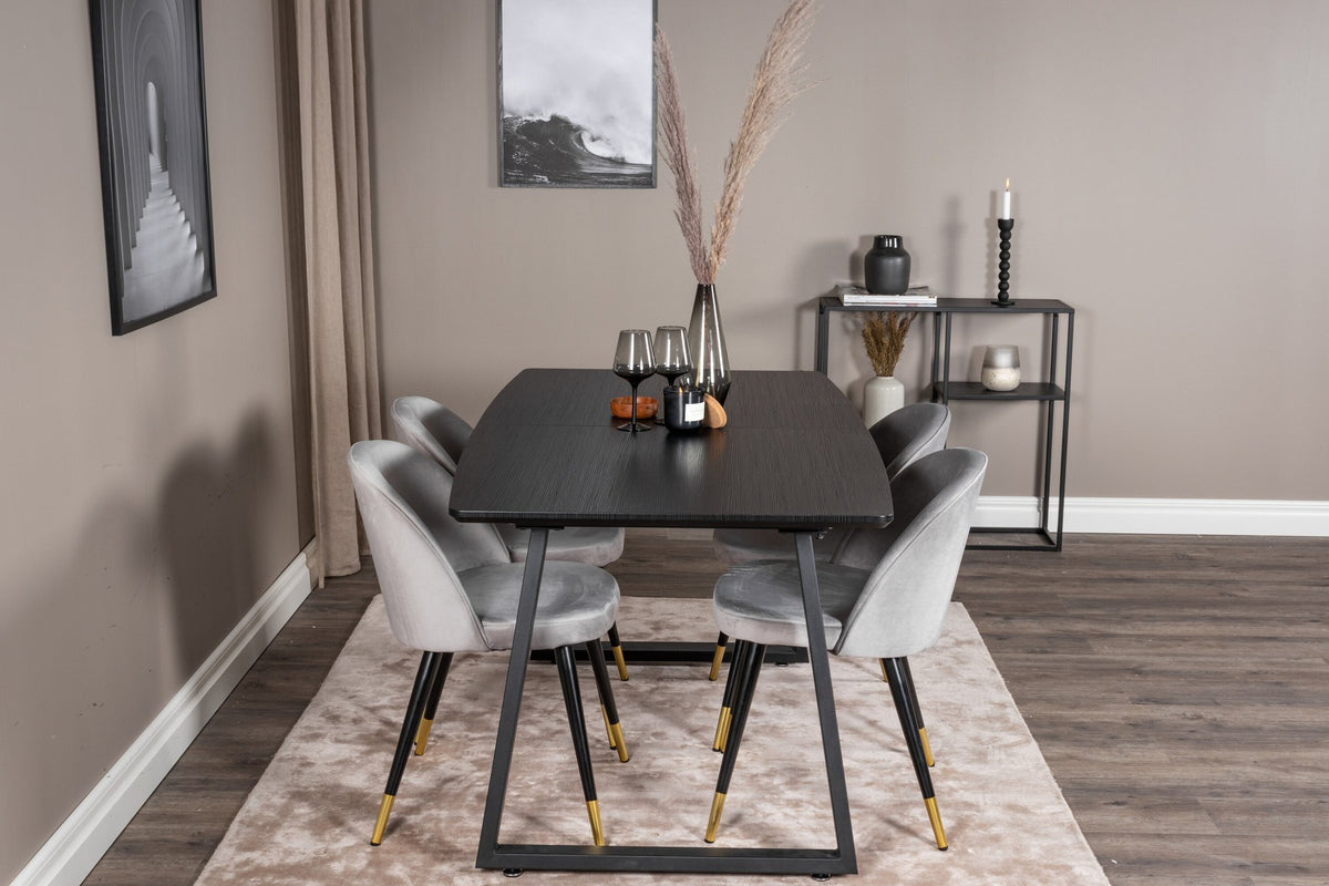 Esszimmerset Inca mit ausziehbarem Holztisch, schwarzer Tischplatte aus MDF und grauen Samtstühlen mit schwarzen Stahlbeinen der Serie Velvet.