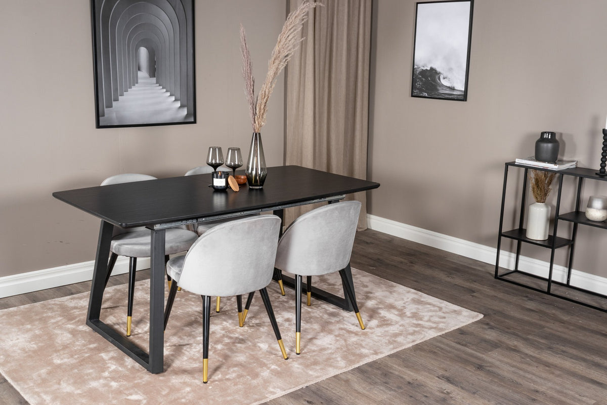 Esszimmerset Inca mit ausziehbarem Holztisch, schwarzer Tischplatte aus MDF und grauen Samtstühlen mit schwarzen Stahlbeinen der Serie Velvet.