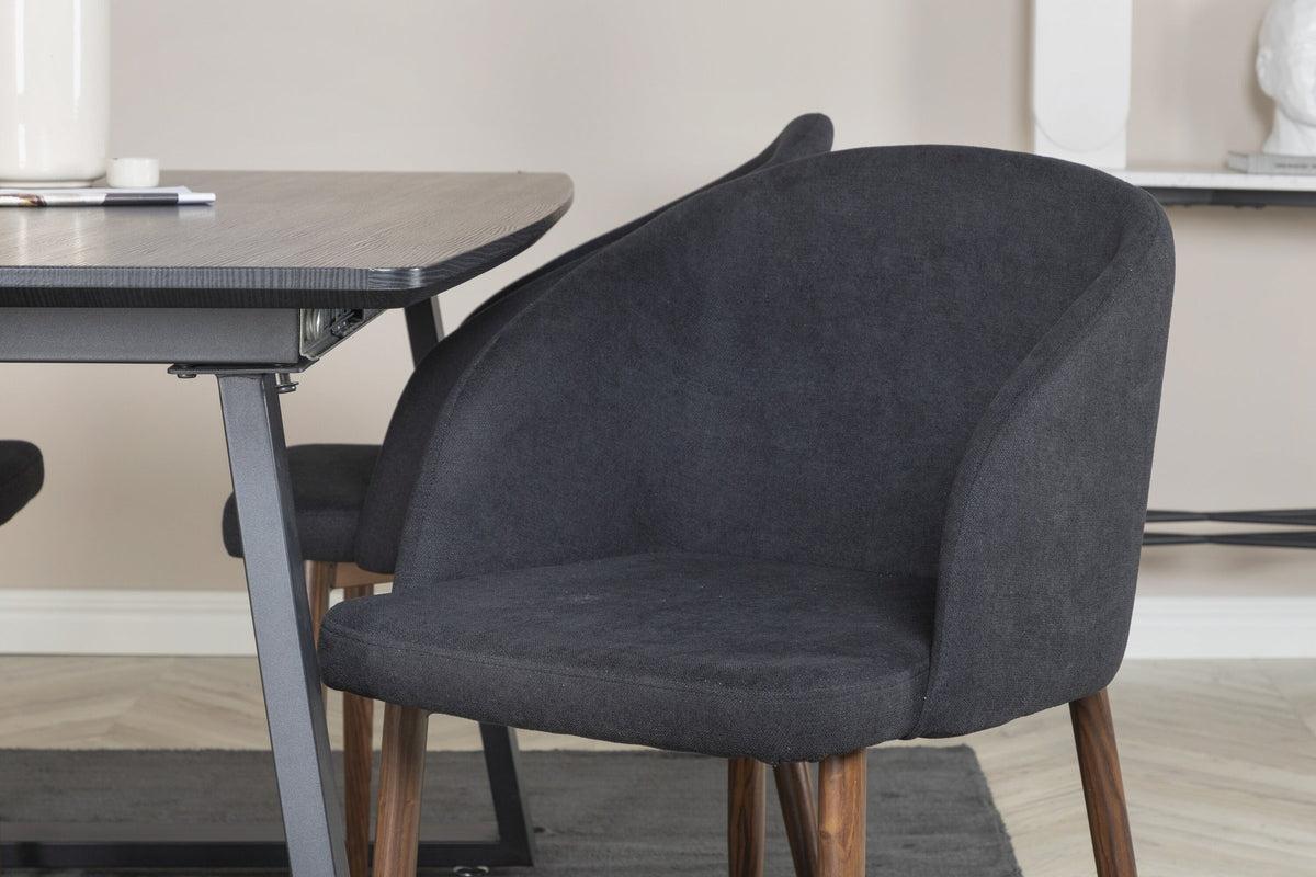 Schwarzes Esszimmerset: 2 Stühle aus MDF und Stahl mit Folienoberfläche sowie rechteckiger Esstisch mit Stahlbeinen, Tischplatte 160 x 85 cm.