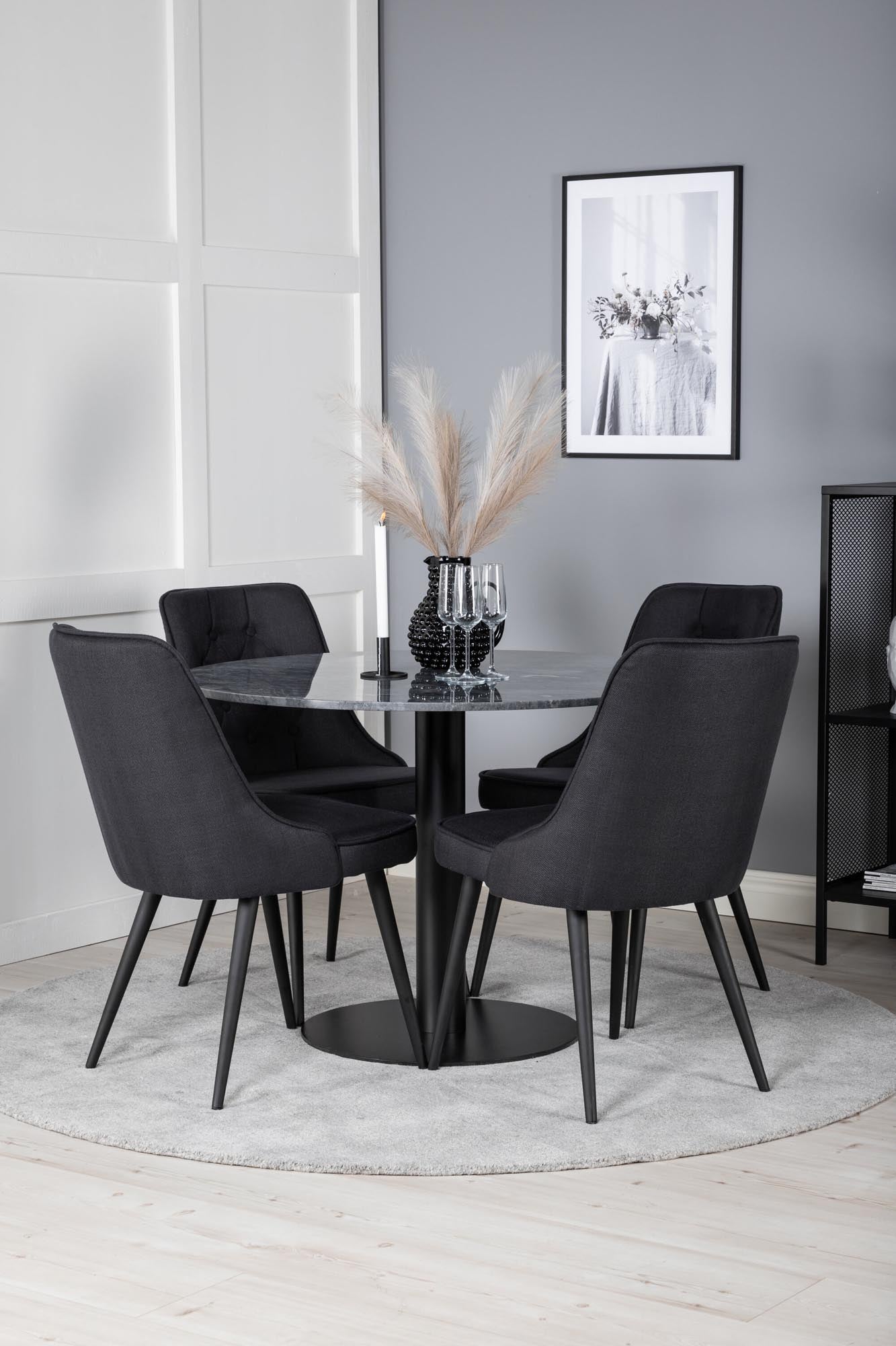 Elegantes Esszimmerset mit runder Marmortischplatte und ergonomischen Samtstühlen. Ideal für gesellige Abende und stilvolle Anlässe.