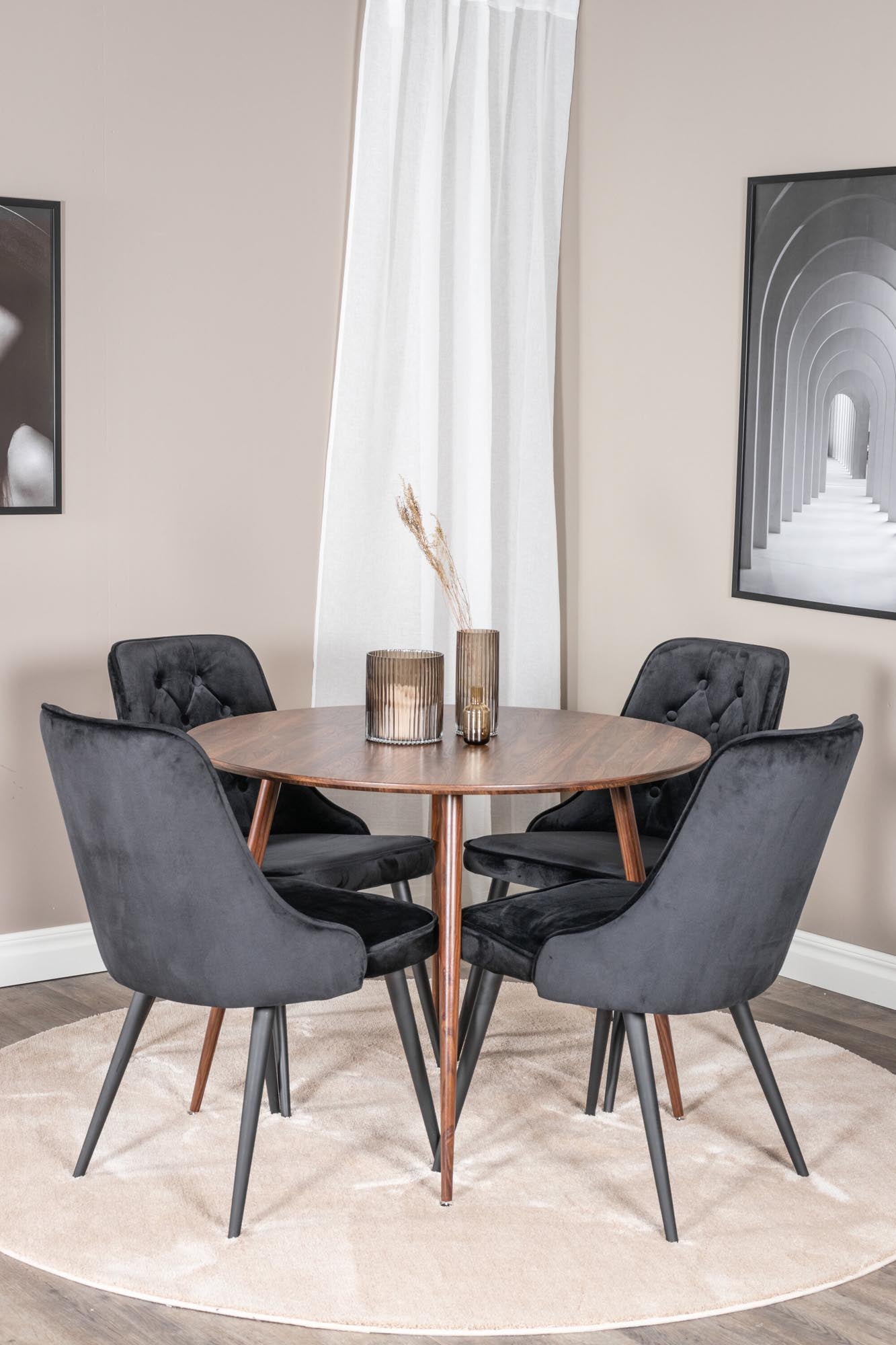 Elegantes Plaza Esszimerset mit Velvet Deluxe Stühlen, Ø100 cm. Ideal für gemütliche Abende und stilvolle Dinnerpartys.