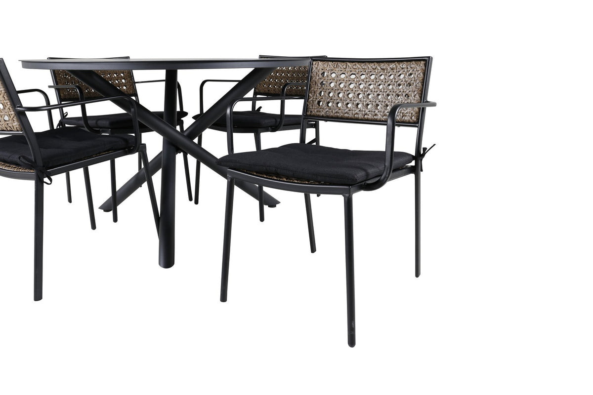 Runder Esstisch Ø120 cm aus schwarzem Aluminium mit vier Gartenstühlen aus Aluminium und Polyesterbezug in Naturfarbe im Aussenbereich.