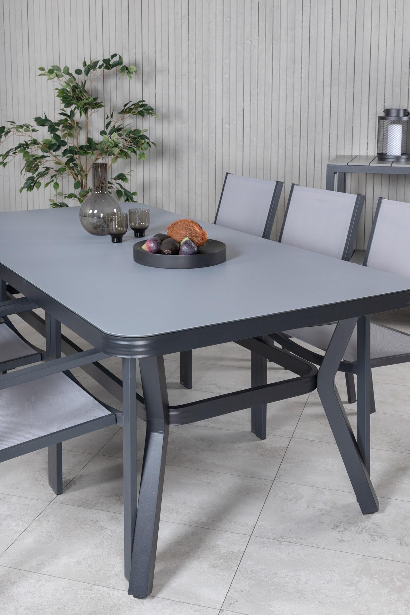 Virya Gartentisch Set mit 6 Stühlen in Schwarzgrau präsentiert im Onlineshop von KAQTU Design AG. Gartentischset ist von Venture Home
