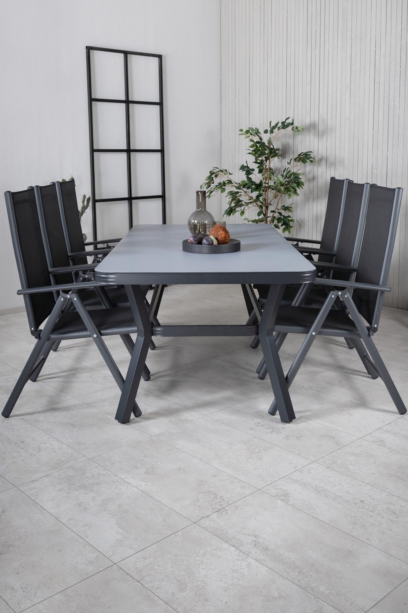 Entdecken Sie das elegante Virya Outdoor-Tischset von Venture Home: 200 cm Tisch und 6 komfortable Break-Stühle für unvergessliche Momente im Freien.