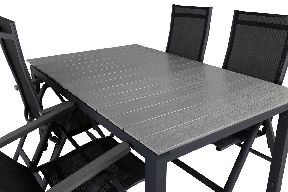 Schwarzer Albany-Stuhl mit grauem Teakholz und Textilene neben ausziehbarem Levels Gartentisch aus Aluminium und Aintwood in Schwarz/Grau