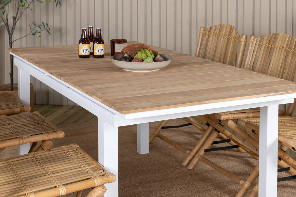 Gartentischset Cane & Mexico von Venture Home: Teakholz-Tisch mit Rattan-Beinen und Aluminium-Stühle in Natur, ausziehbar auf 240 cm.