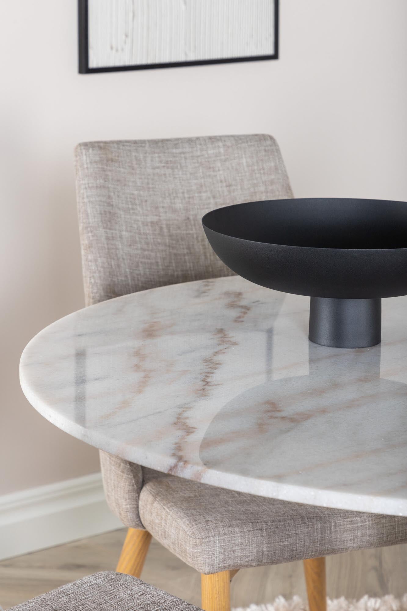 Elegantes Set: Marmor-Tisch, schwarze Metallbasis, graue Stühle. Modernes Design für gesellige Runden zu viert.