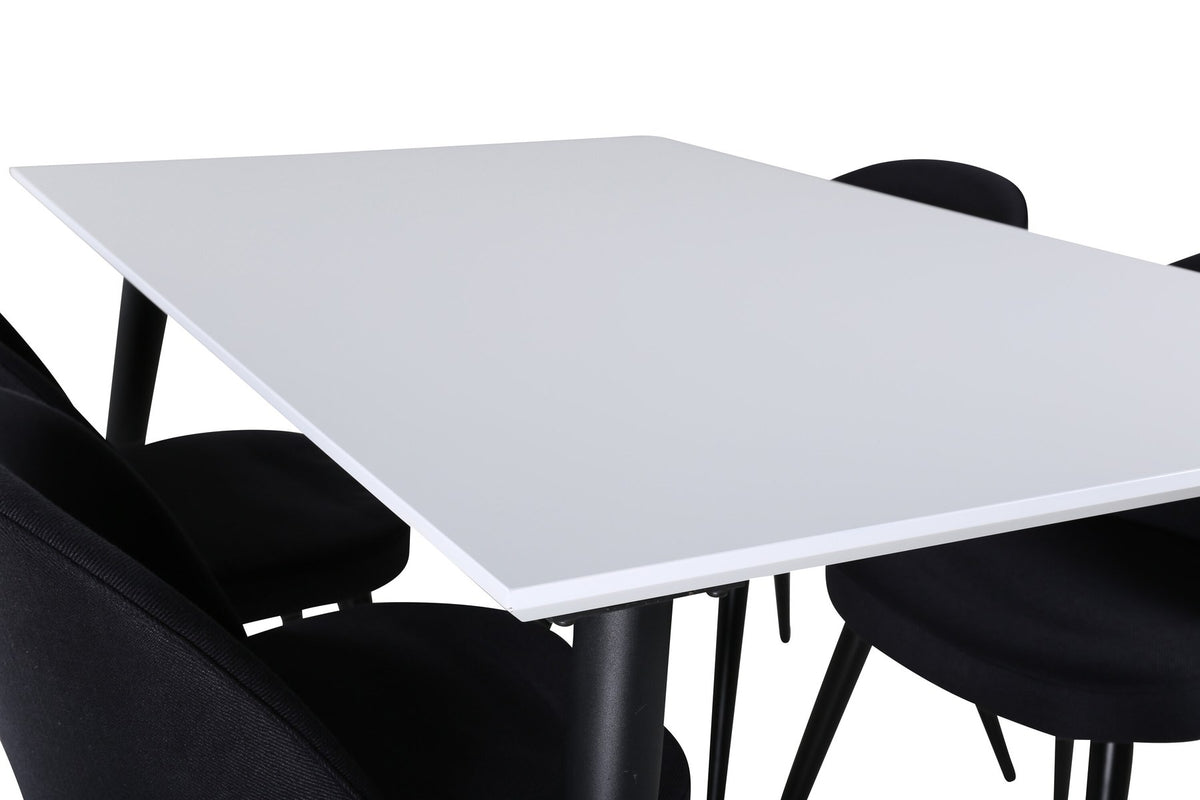 Rechteckiger Esstisch mit weisser HPL-Tischplatte und schwarzen Stahlbeinen, daneben zwei schwarze Polsterstühle mit gepolsterter Sitzfläche.