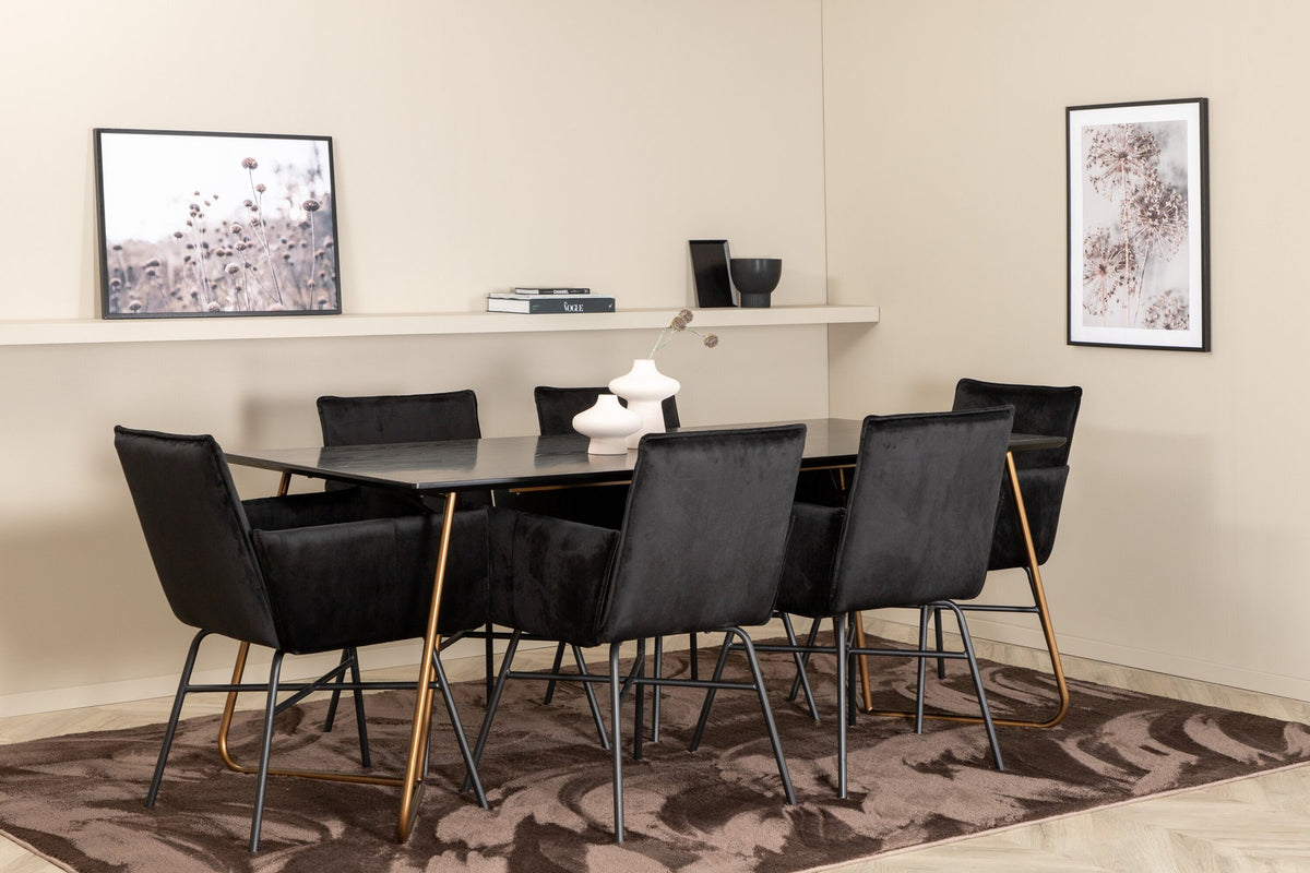 Petra Esszimmerset: Esstisch mit schwarzer MDF-Platte und Furnier in Used-Optik, sechs Stühle mit Samtbezug in Kupfer/Schwarz und Eisenbeinen.
