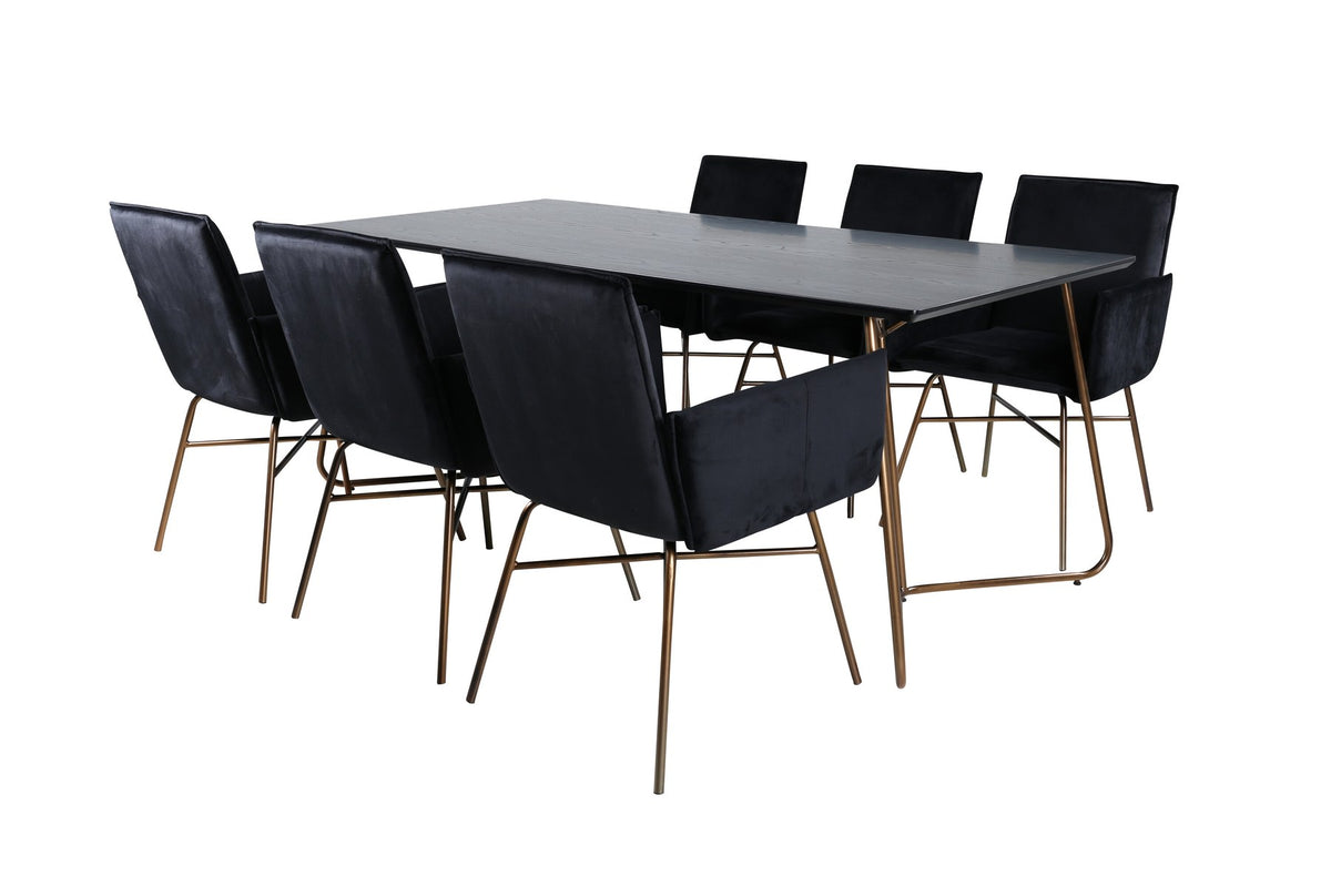 Petra Esszimmerset: Esstisch mit schwarzer MDF-Platte und Furnier in Used-Optik, sechs Stühle mit Samtbezug in Kupfer/Schwarz und Eisenbeinen.