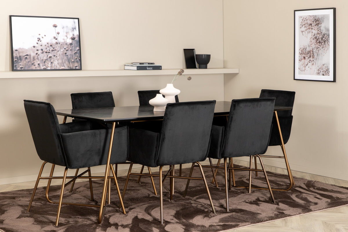 Petra Esszimmerset: Esstisch mit schwarzer MDF-Platte und Furnier in Used-Optik, sechs Stühle mit Samtbezug in Kupfer/Schwarz und Eisenbeinen.