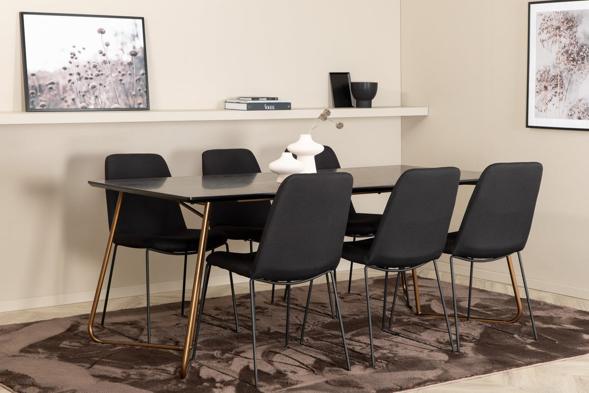 Schwarzes Esszimmerset Petra von Venture Home: Esstisch mit Tischplatte aus MDF und Furnier sowie sechs Stühle Muce mit Stahlbeinen.