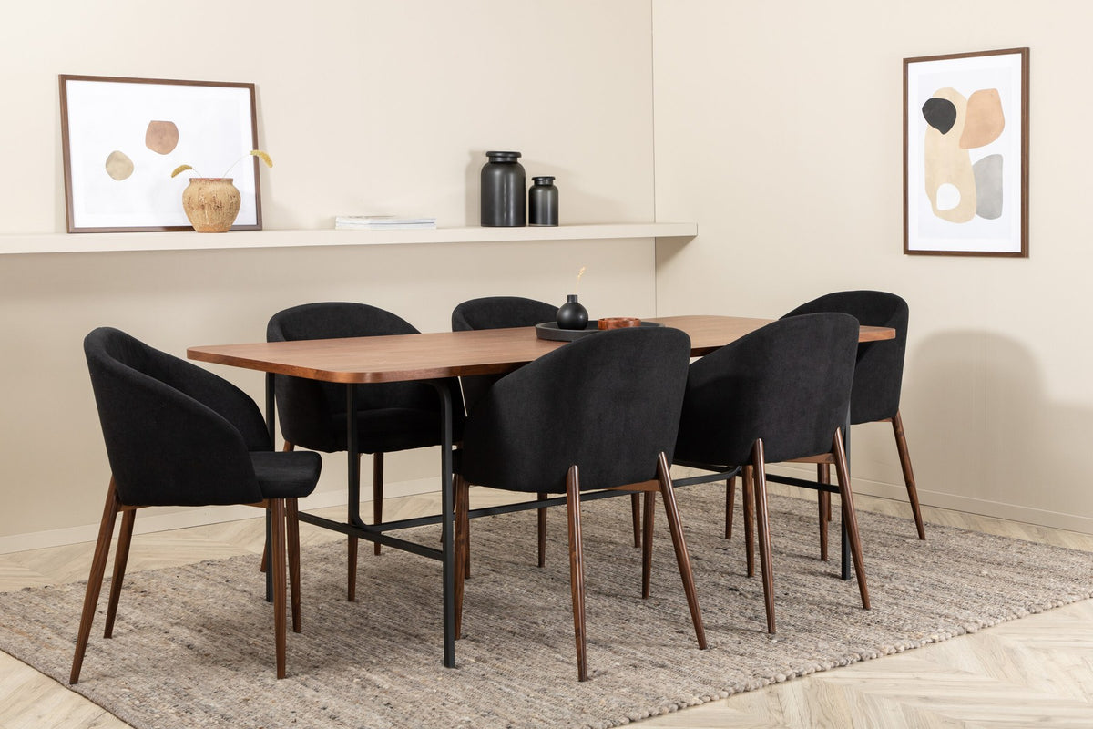 Esszimmerset Uno: rechteckiger Tisch mit MDF-Furnier-Platte in Nussbaum und schwarzem Stahlgestell, dazu Arch Stühle mit Polyesterbezug.