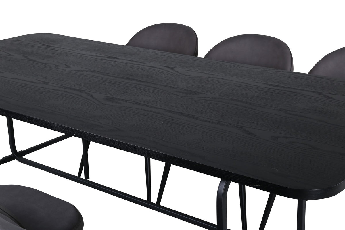 Esszimmerset Uno & Velvet: rechteckiger Esstisch mit schwarzer MDF-Furnier-Platte und Metallgestell, dazu Stühle mit grauem Samtbezug und Eisenbeinen.