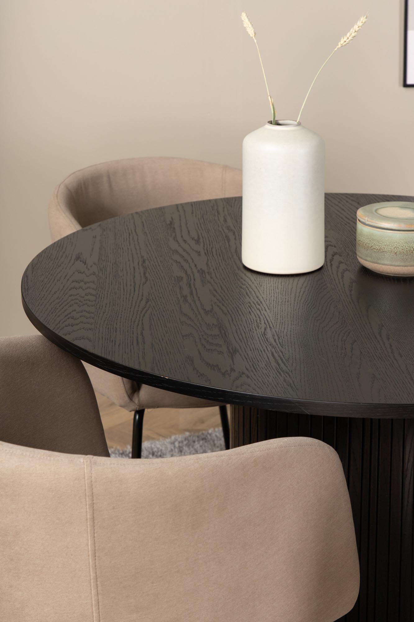 Modernes Esszimmerset Bianca: Stilvoller runder Tisch mit 4 bequemen Samt-Stühlen, ideal für gesellige Abende und elegantes Ambiente.