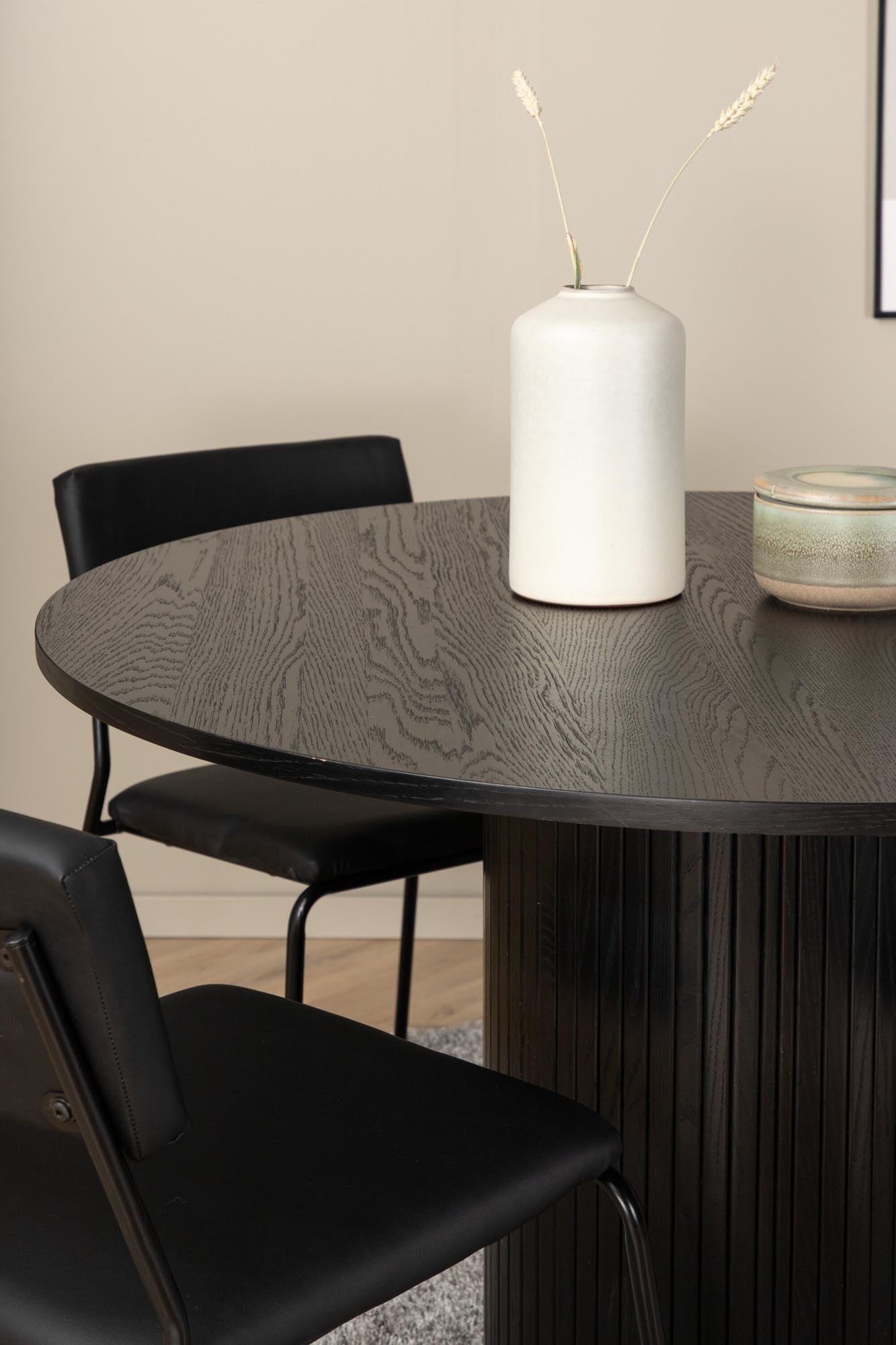 Bianca Esszimmerset + Kenth: Elegantes Design mit schwarzer MDF-Tischplatte und komfortablen Samtstühlen für stilvolle Esszimmermomente.